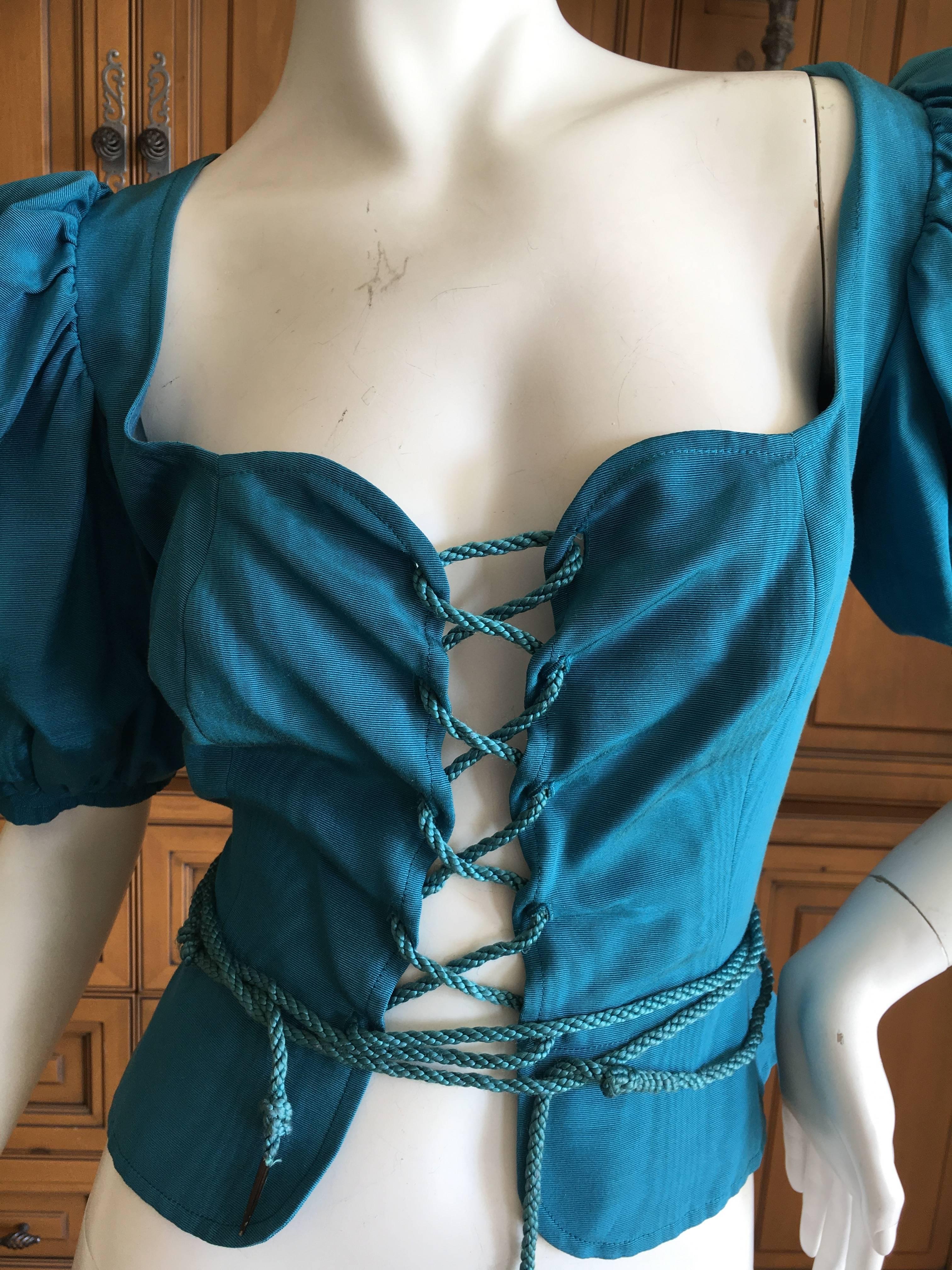 Yves Saint Laurent Rive Gauche 1970's Turquoise Silk Moire Corset Lace Top.
The original version of the corset lace peasant blouse that Yves Saint Laurent revisited throughout his career and has been interpreted for YSL by Tom Ford and Stefano
