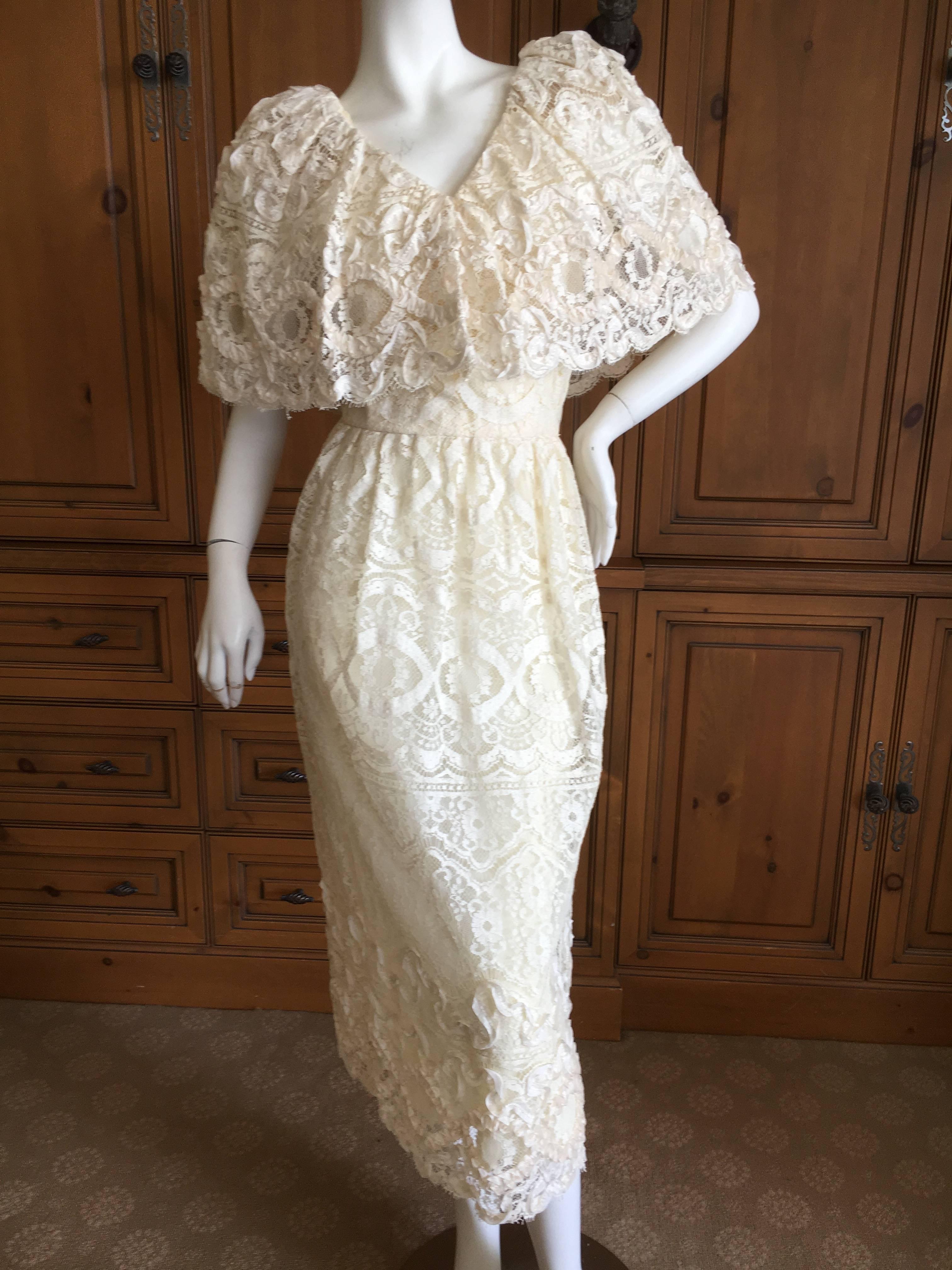 Lovely cream lace dress with a wide cape collar from Morton Myles.
This would be a lovely wedding dress
Bust 36