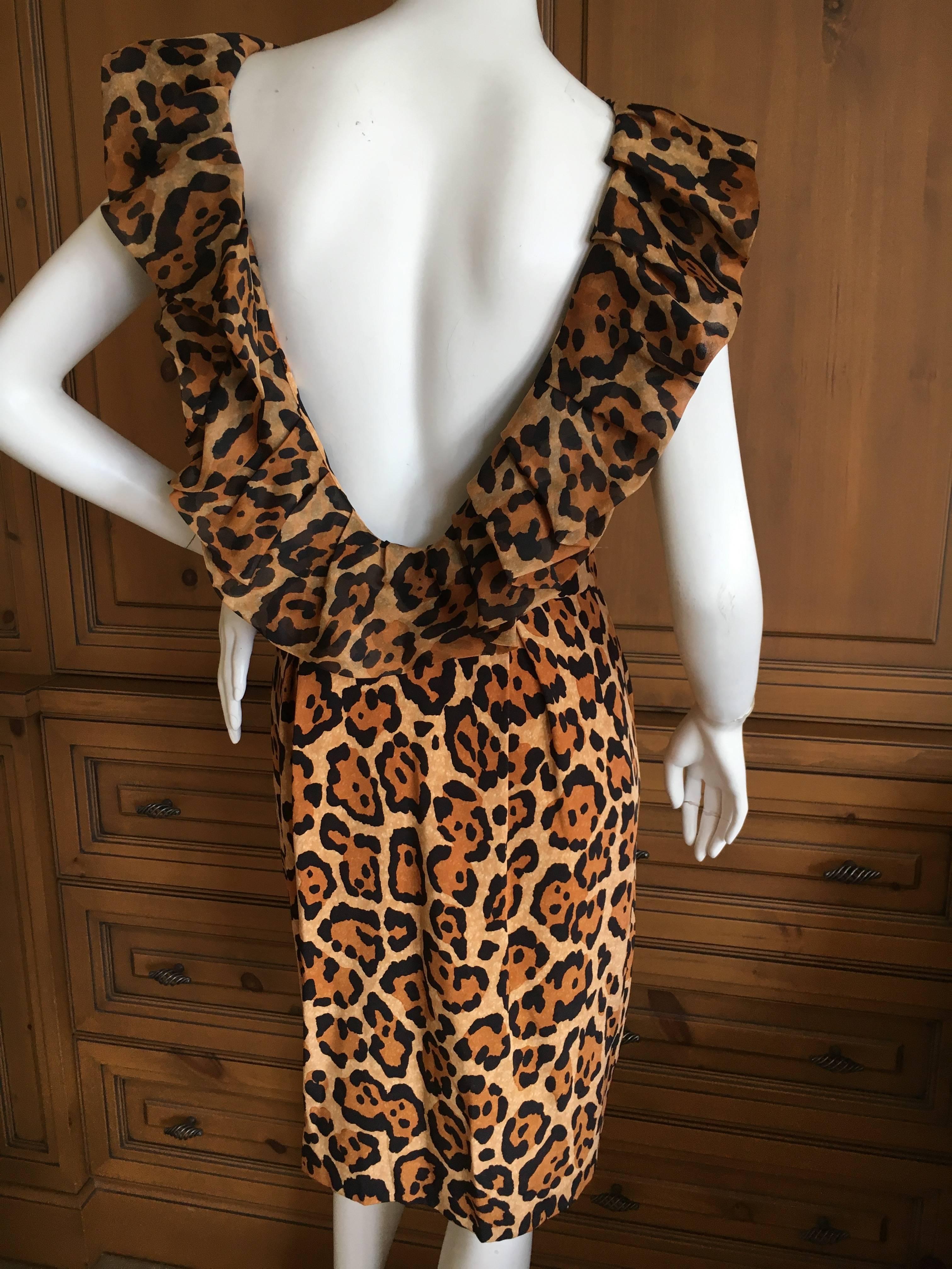Christian Dior Backless Ruffled Leopard Print Silk Cocktail Dress by John Galliano.
This is exquisite.
Size 40
Bust 38"
Waist 28"
Hips 40"
Length 40"
Excellent condition