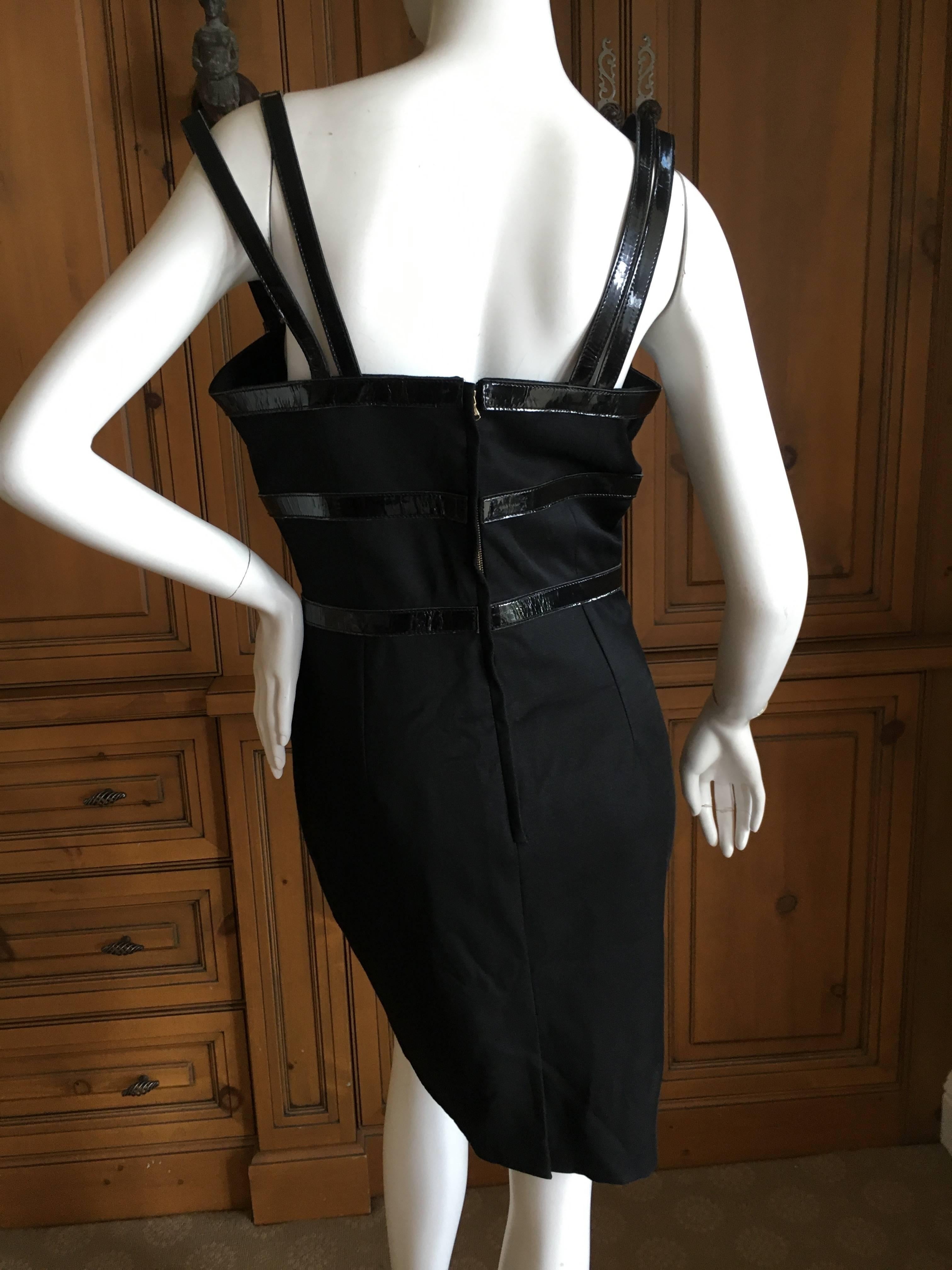 Dolce & Gabbana Vintage Patent Leather Trim Bondage Strap Little Black Dress.
This is so sexy, lined in leopard print 
Size 44
Bust 38"
Waist 28"
Hips 41"
Length 36"
Excellent condition , there is some cracking of the patent