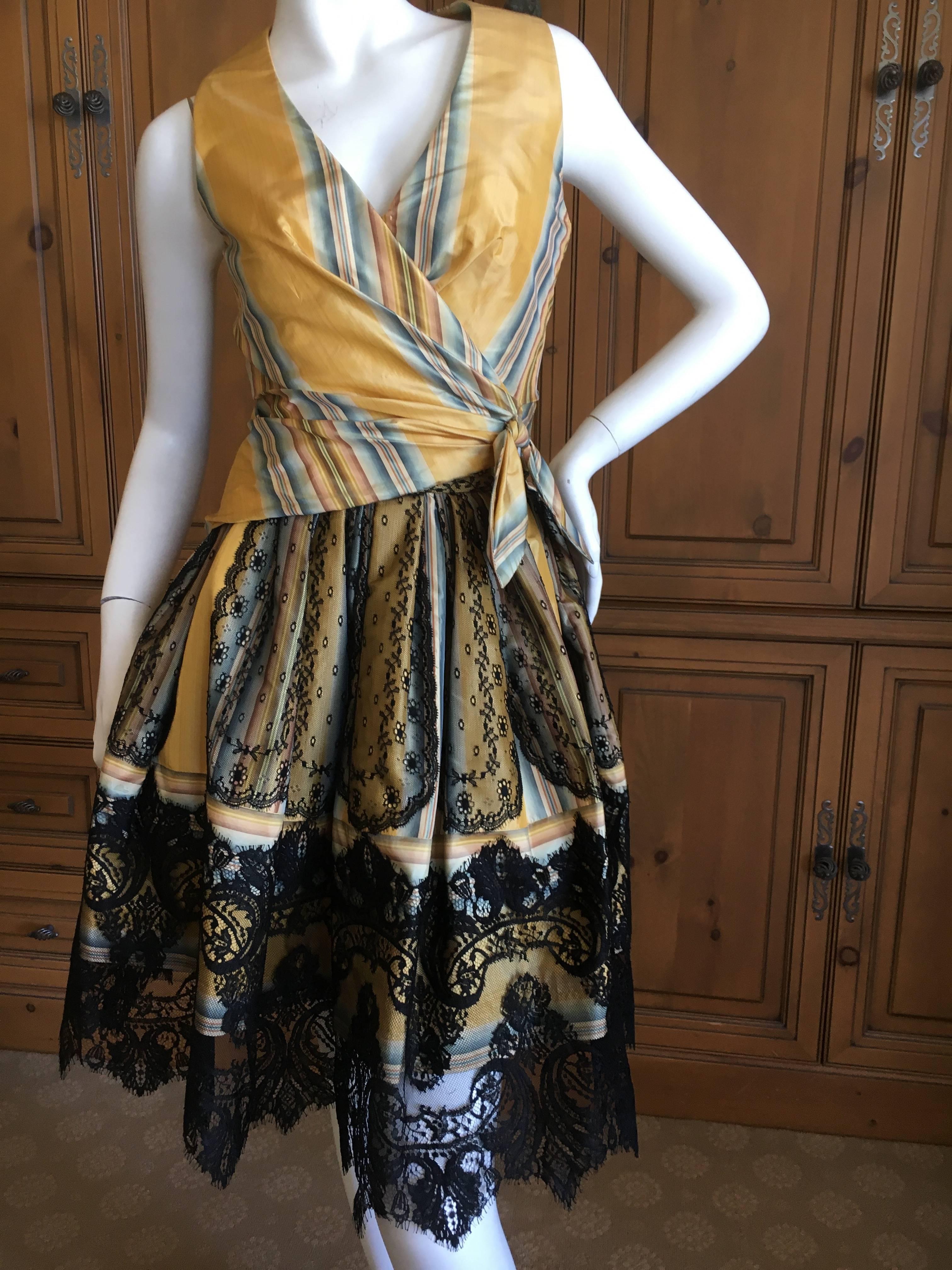 Christian Lacroix Charming Stripe Silk Summer Dress with Artesian Lace Trim Skirt.
This is two pieces , a wrap style sleeveless top and a bubble skirt that would look divine with a mini crinoline underneath..
So chic, so summery.
Size 38
Bust 34