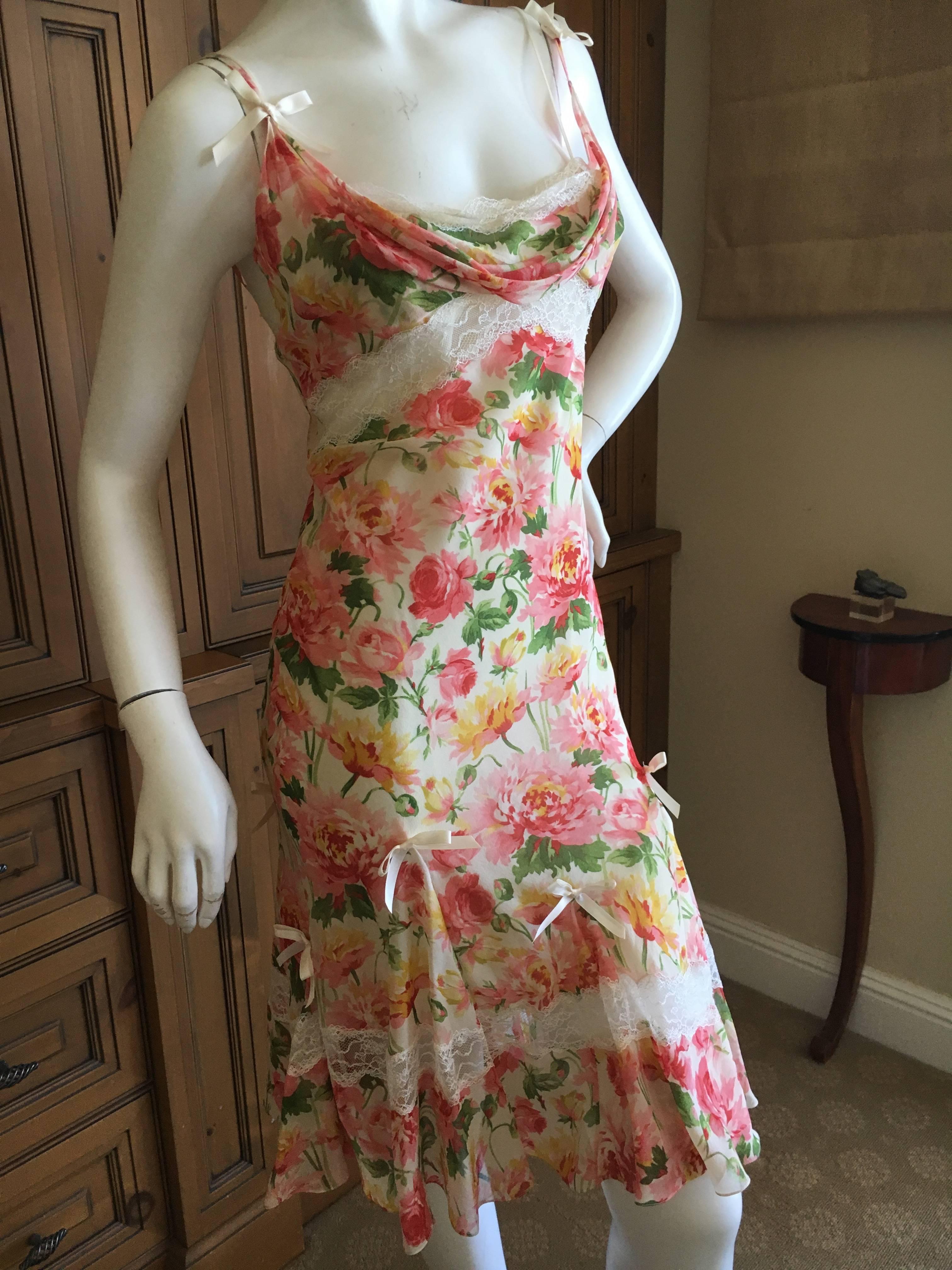 Christian Dior by John Galliano Romantic Silk Floral Dress with Sheer Lace Inserts.
This is so sweet , perfect for a summer garden party. 
Insets of sheer lace below the bust and at knee length, with little bow's.
Size 38
Bust 38"
Waist
