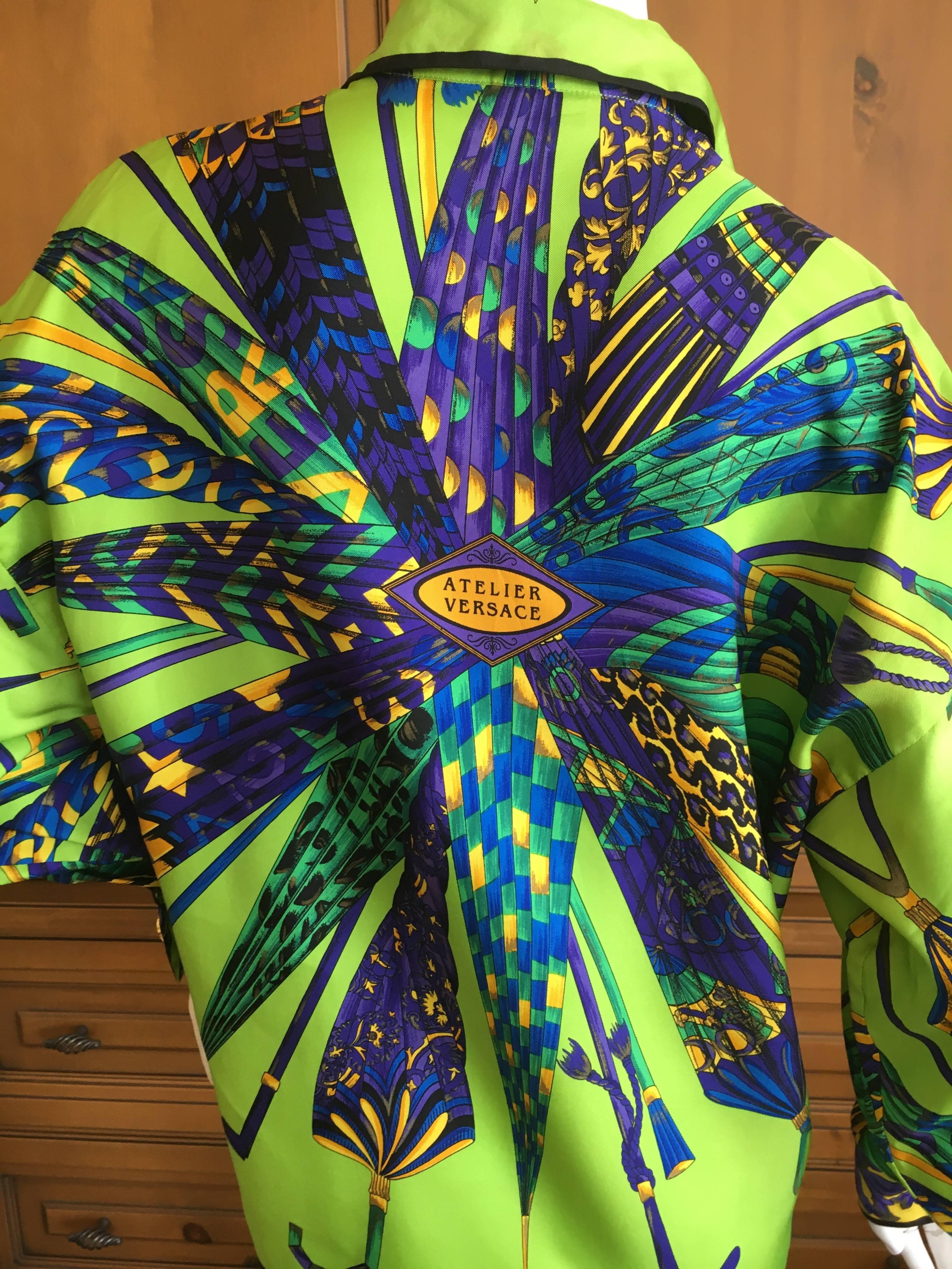 Gianni Versace Couture  Atelier Versace Silk Umbrella Print Blouse.
This is an exquisite print in brilliant colors.
Marked size 42, this is very large, and could be worn by a man.
Bust 42"
Waist 40"
Length 26"
Sleeve 21"
Across