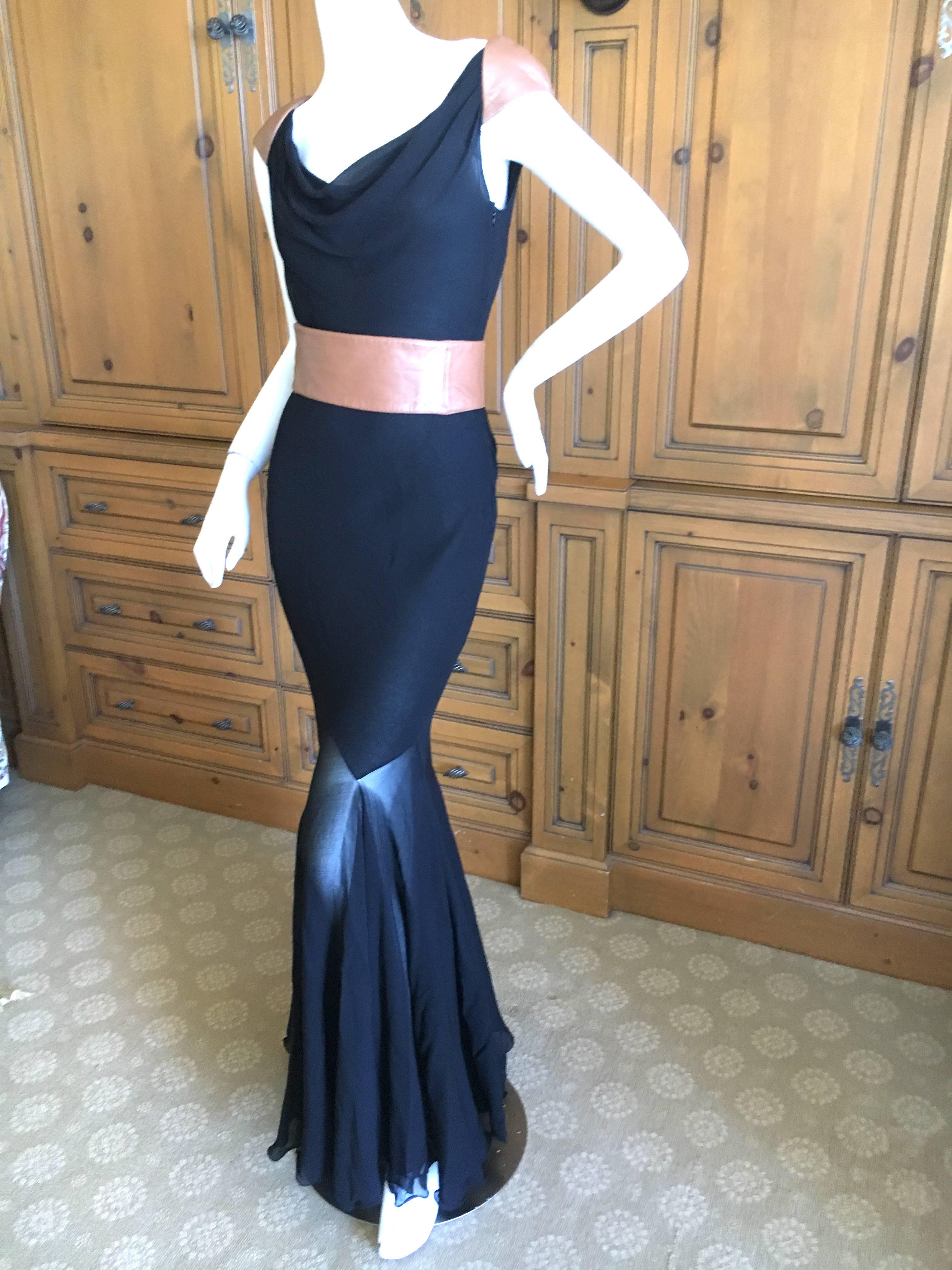 Gianni Versace Couture 1980's Backless Leather Trim Mermaid Gown with Wide Belt. 
Wear with or without the belt.
Very sexy back.
This is so much prettier than the photos show. 
The mermaid part of the skirt is sheer.
Size 38
 Bust 39