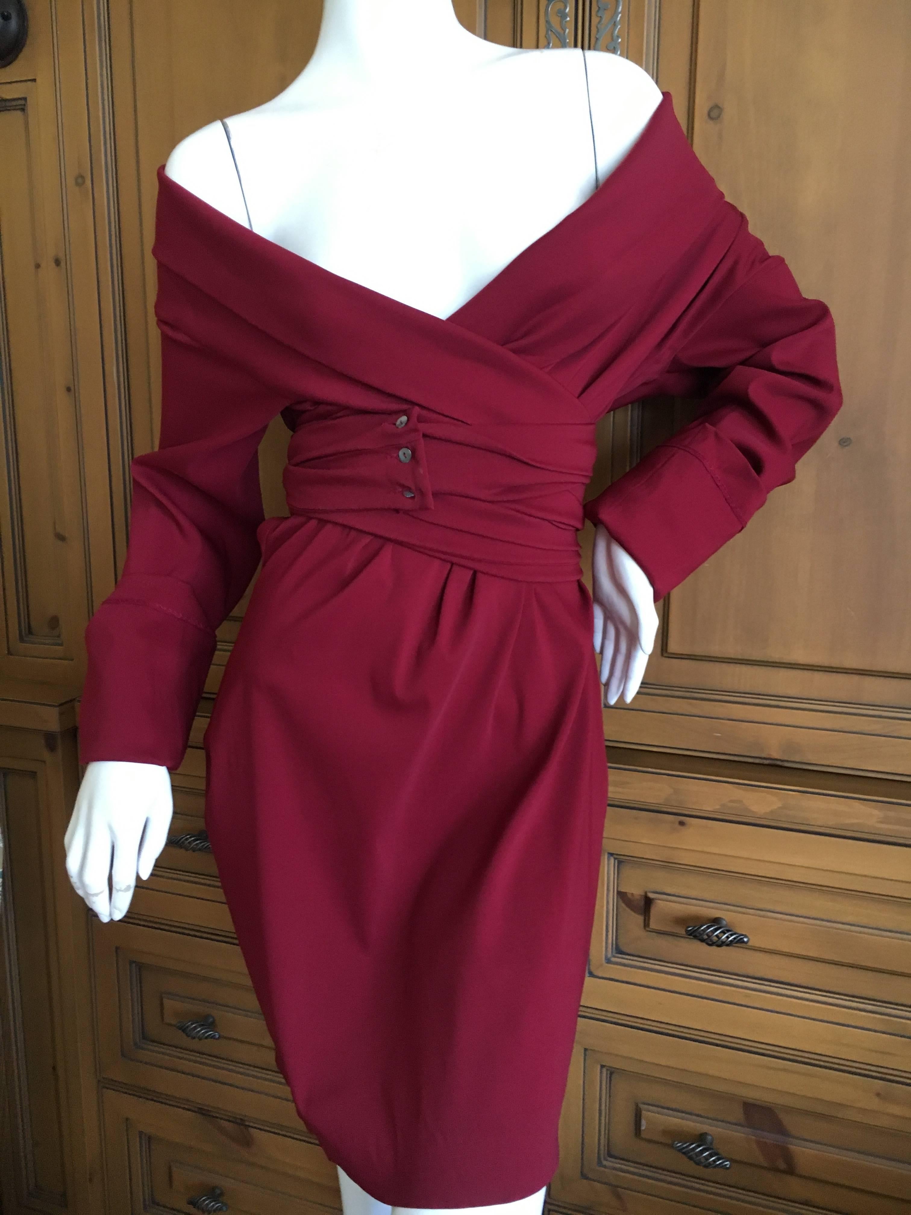 Romantic red wrap dress by Romeo Gigli for Bergdorf Goodman circa 1986.
Long ties wrap a few times around the body and buttons in the front. 
One of the thin shell buttons is broken.
Size 40
Bust 40