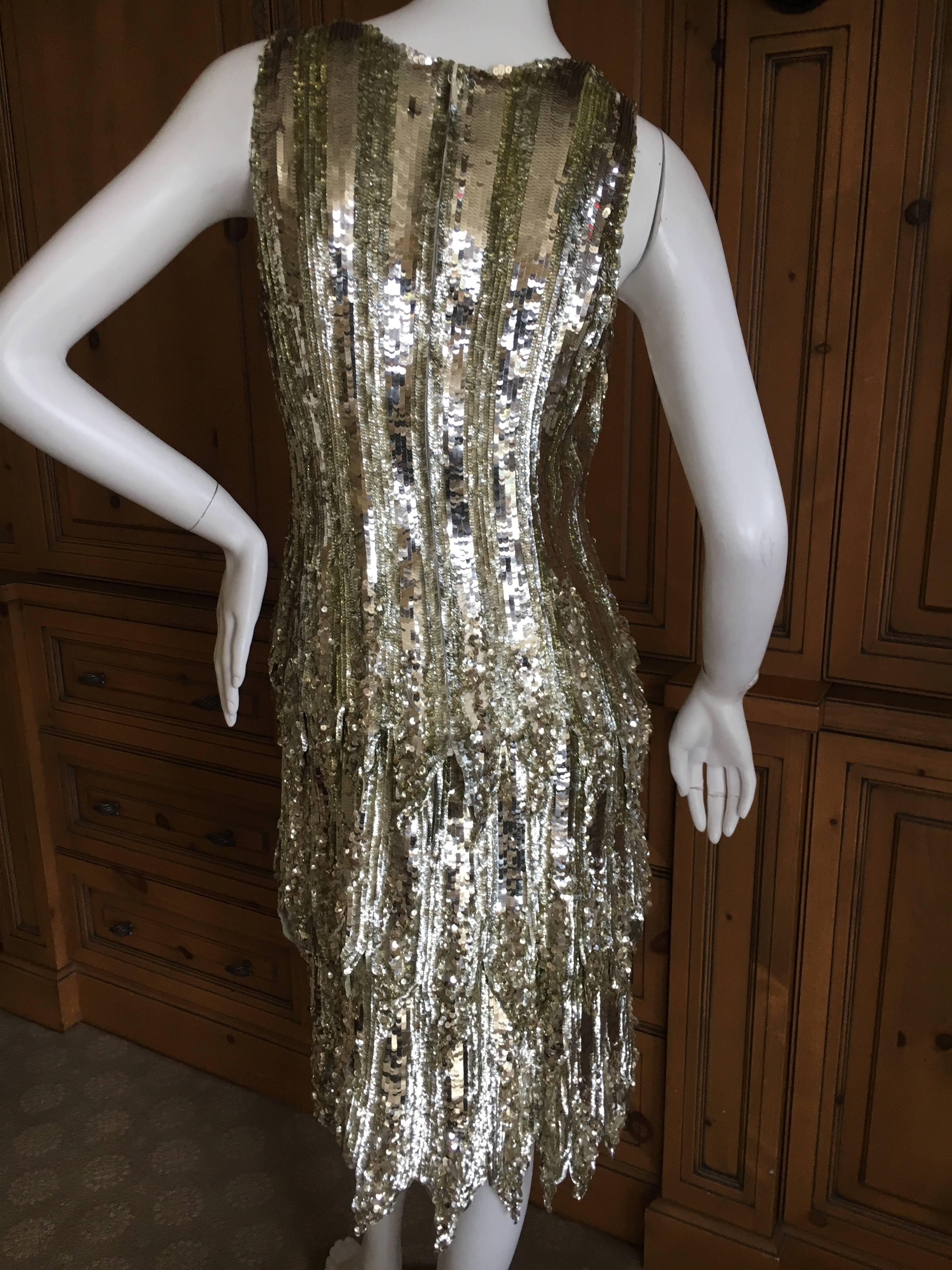 Chanel Haute Couture Fall 2002 Gold Sequin Flapper Dress by Karl Lagerfeld.

Haute Couture is the ultimate expression of fashion, created entirely by hand, in the Paris atelier , as ruled by France's  Fédération de la Haute Couture et de la