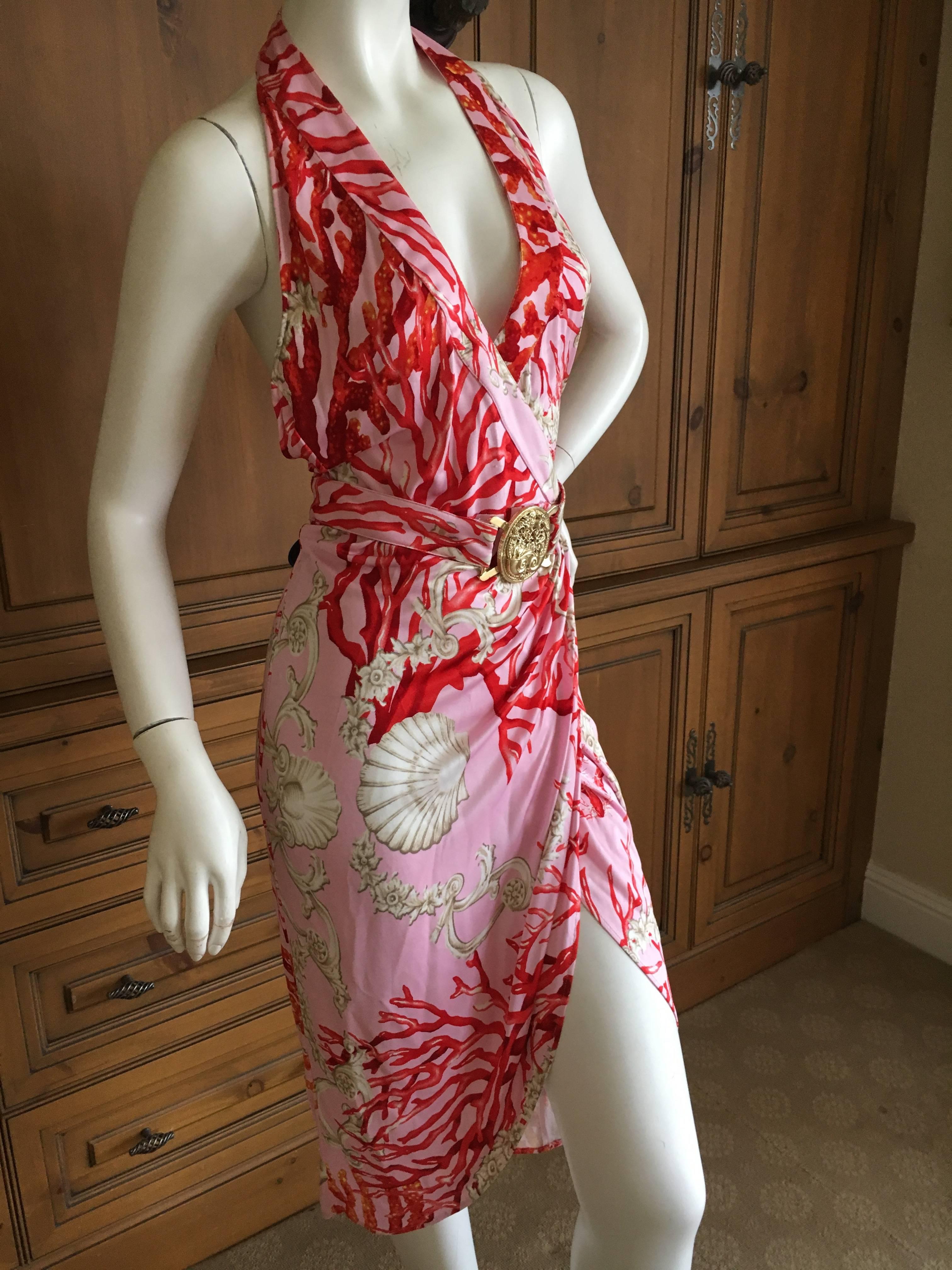 Versace Vintage Coral and Shell Print Halter Dress with Bold Gold Medallion Belt. .
Wrap style.
Viscose .
Size 42
Bust 38