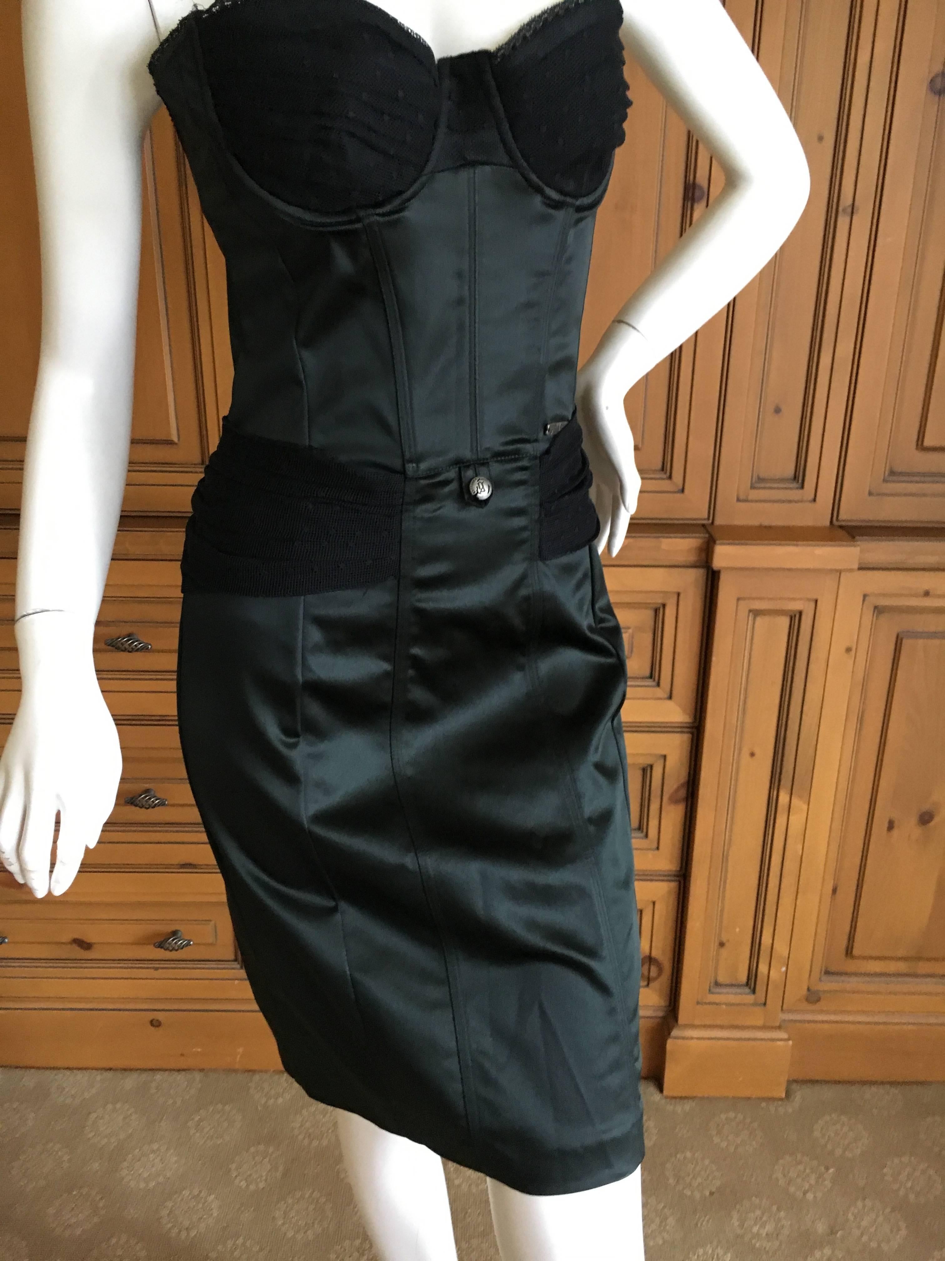 Super sexy little black corset dress from John Galliano.
Full upper corset in tulle, with satin body con dress.
Size 40
Bust 36