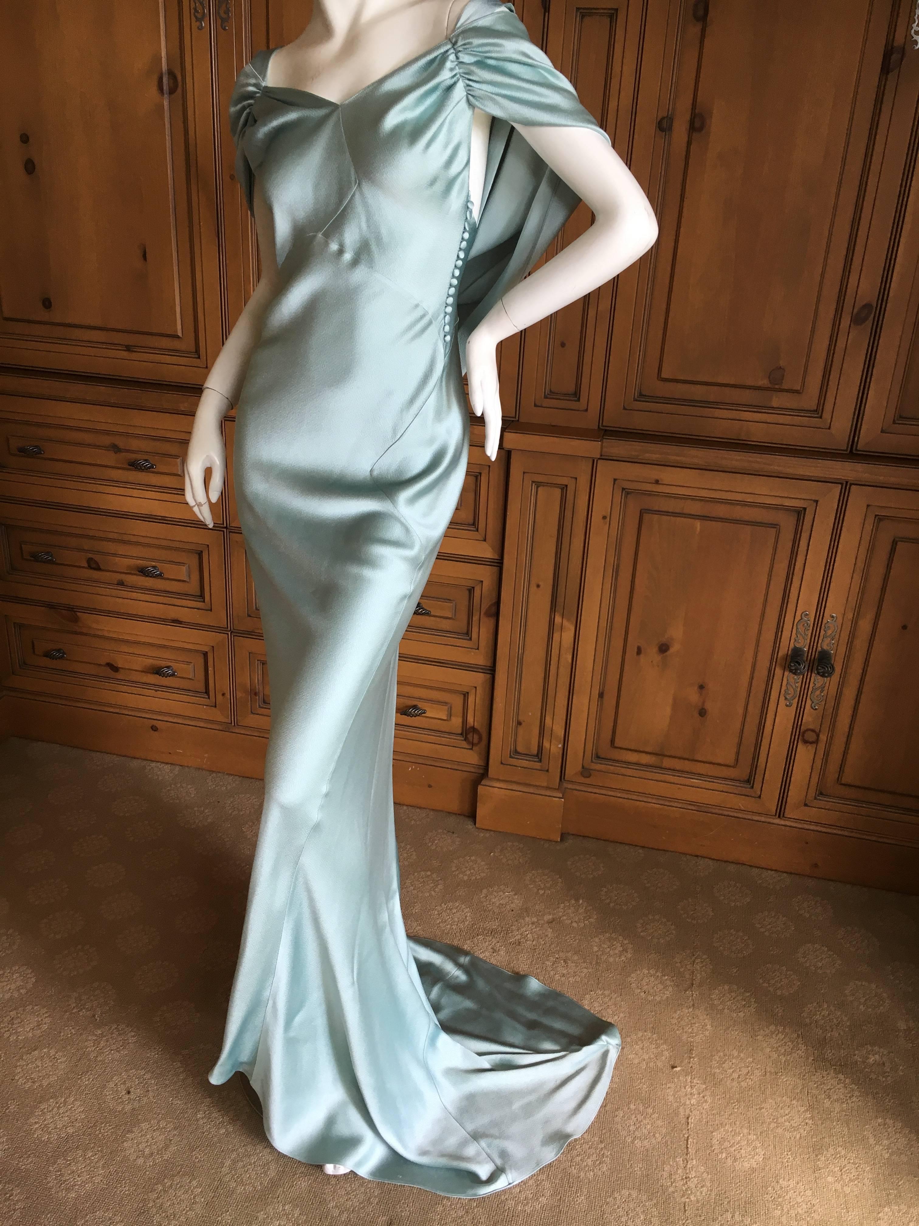 Christian Dior by John Galliano Dreamy Drape Back Turquoise Silk Evening Dress.
This is an exquisite hammered silk in a luscious shade of Tiffany or light Robin's Egg blue.
Bias cut with a draped back and train, this is classic Galliano for