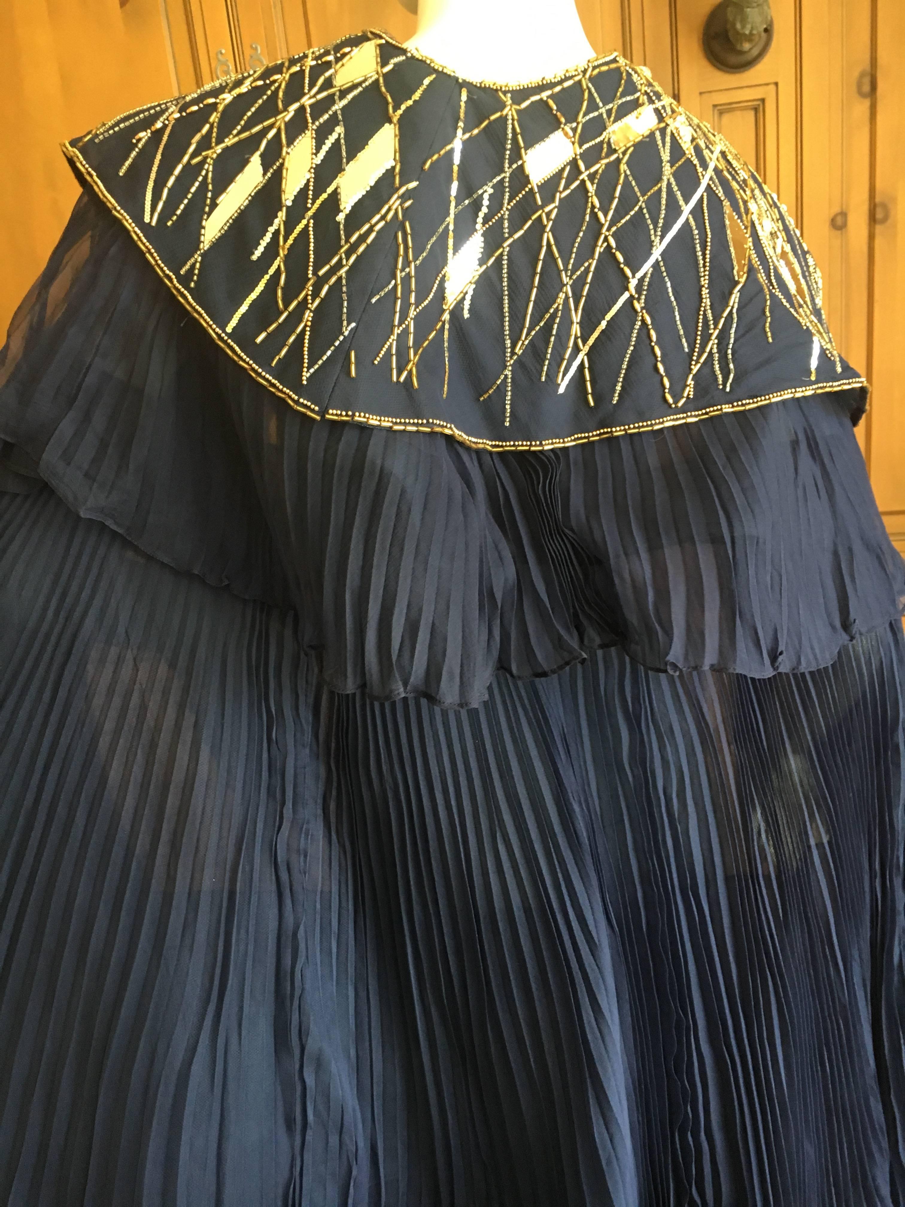 Bernard Perris Paris Dramatic Navy Blue Pleated Cape.
Wonderful navy blue sculptural cape with sequin details from Bernard Perris, Paris.
Multiple tulle layers add volume to this great vintage piece.
 The front large sequin is damaged