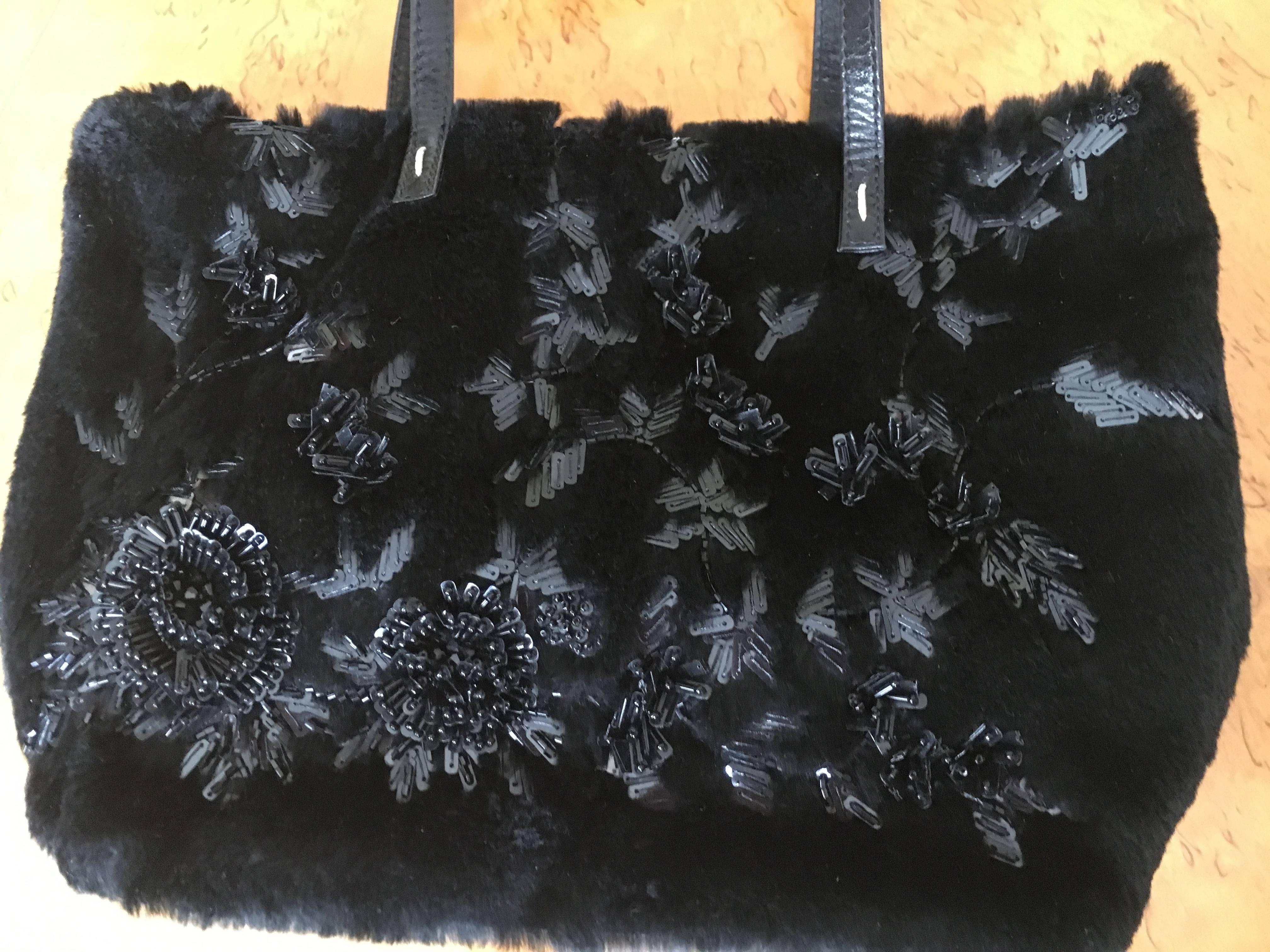 Valentino Garavani Sheared Black Mink Embellished Handbag.
This is exquisite, but hard to photograph.
11
