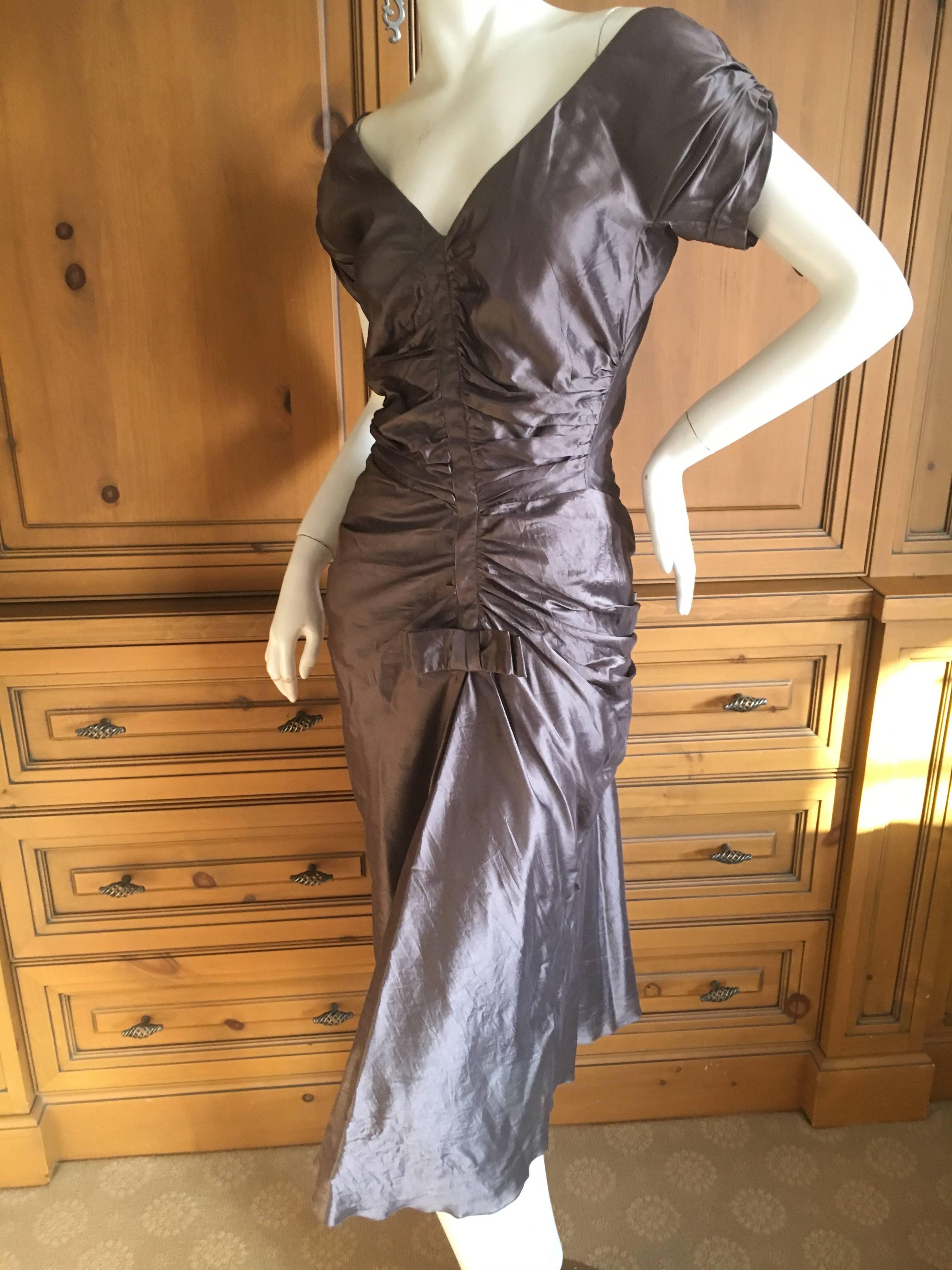 Christian Dior by John Galliano Gray Dupioni Silk 1940's Style Dress.
Wonderful gray dupioni silk dress with back bow by John Galliano for Christian Dior.
Size 38
Bust 36