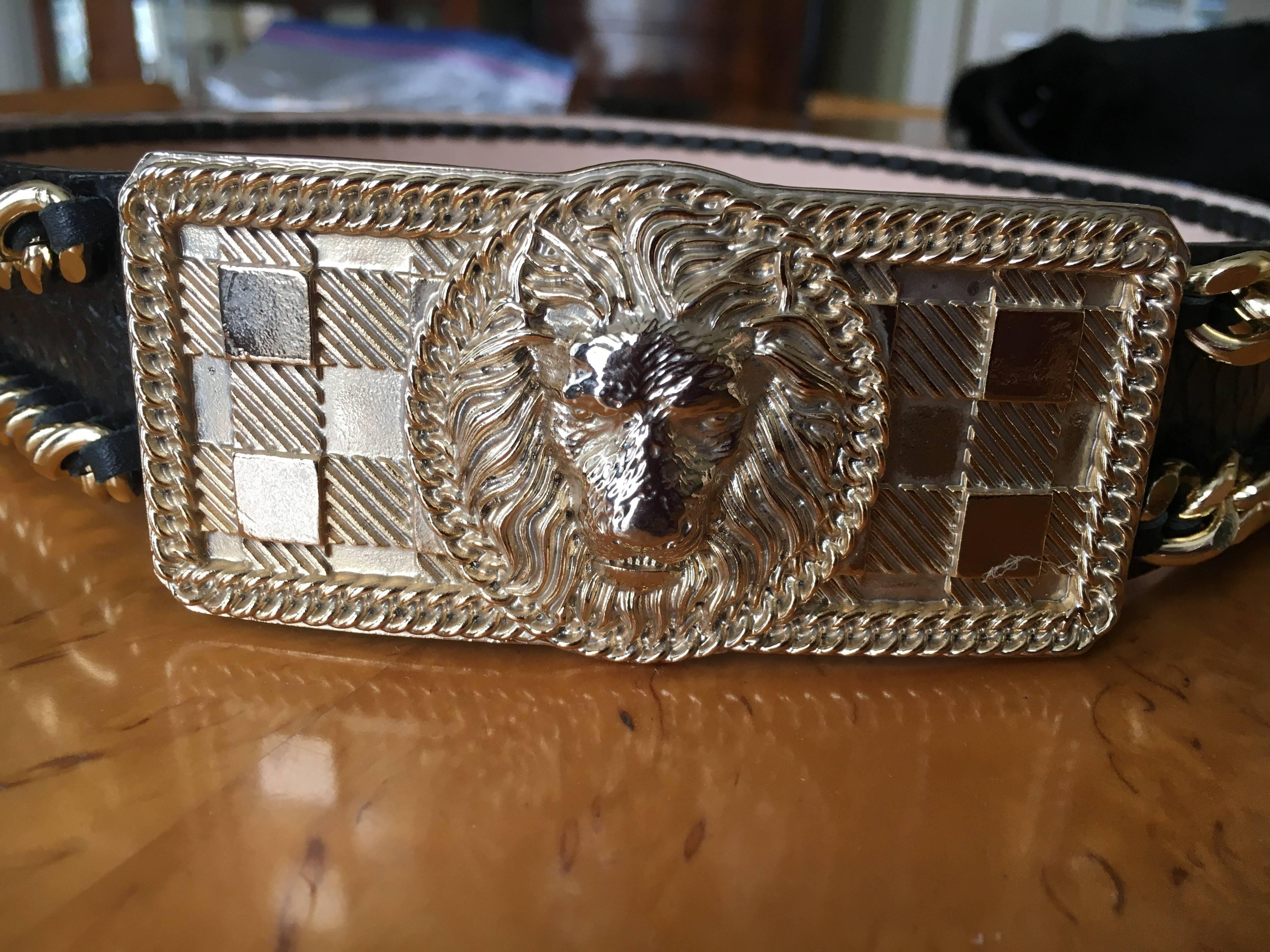 Balmain Chain Accented Belt with Lion Head Buckle.
1.75