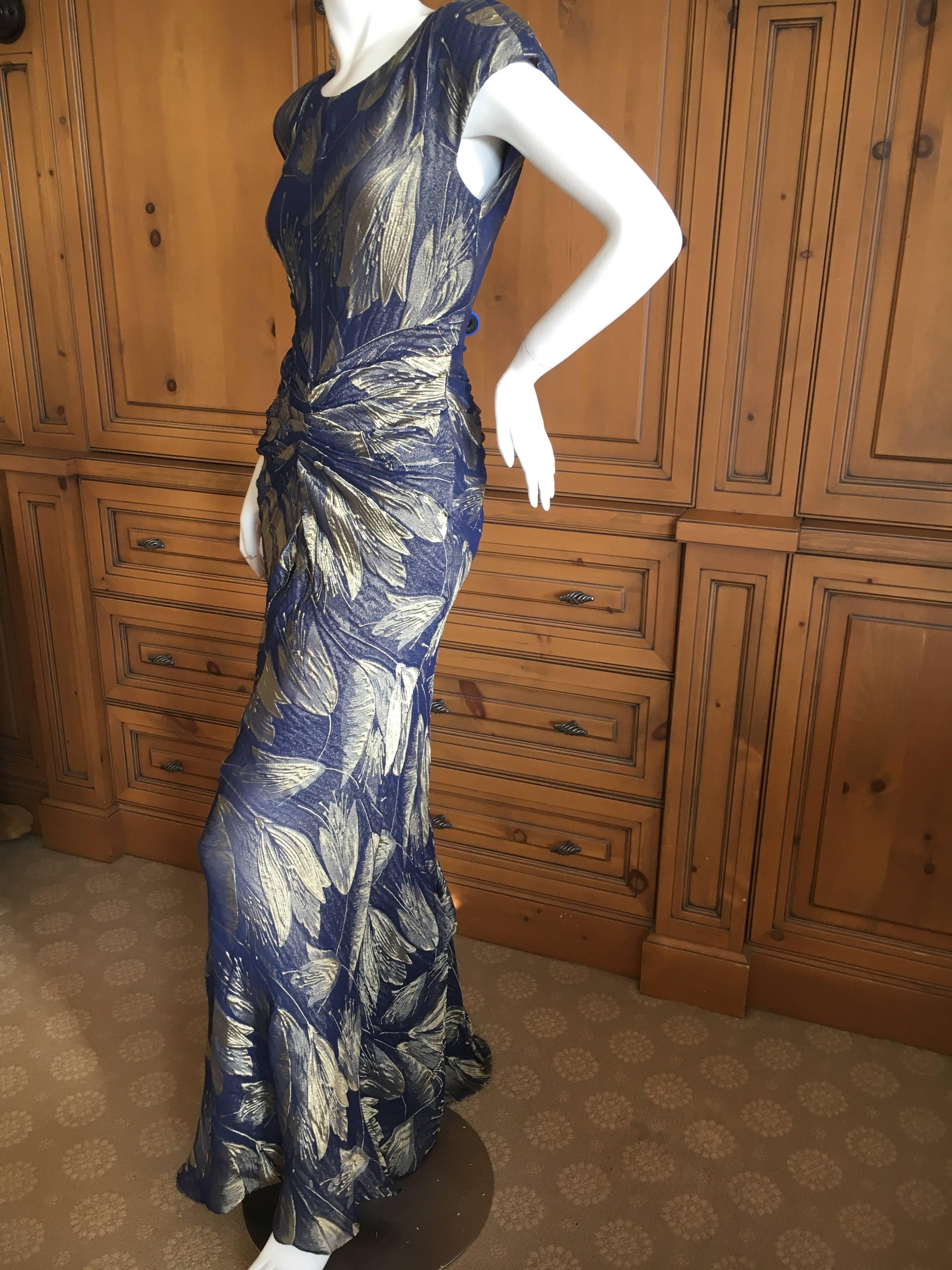 Christian Dior Vintage Golden Jacquard Tulip Print Evening Dress by Galliano.
Zips up the back.
Please use zoom feature to see, it is hard to photograph, but so pretty.
Slate or navy blue with golden thread jacquard in a stylized tulip pattern.
