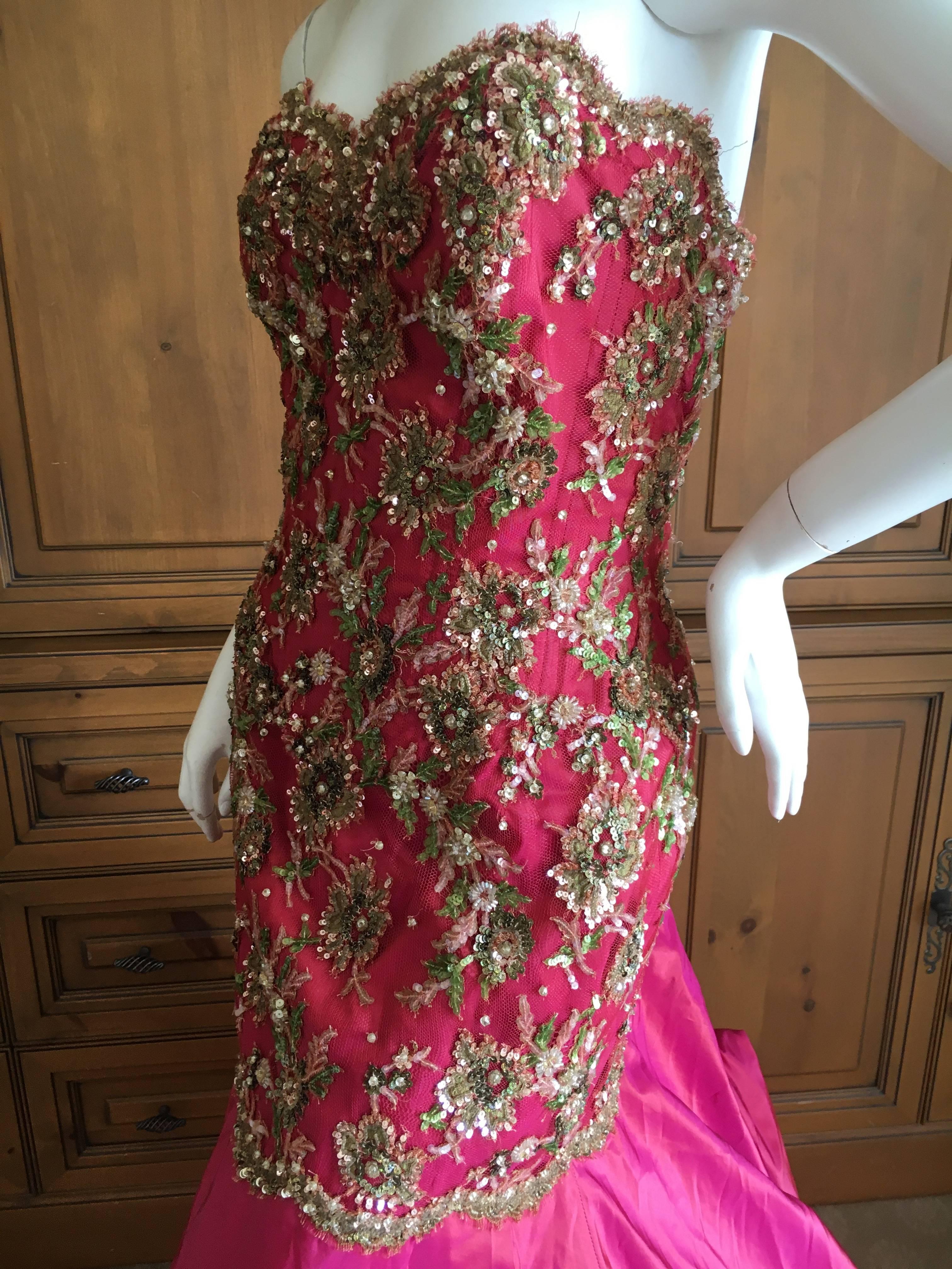Wonderful heavily embellished strapless evening gown from Vicky Teil Couture Paris.
This has a built in inner corset  and zips up the back.
Please use the zoom feature to see the details of teh embellsihment, it is really lovely.
Size 38
Bust