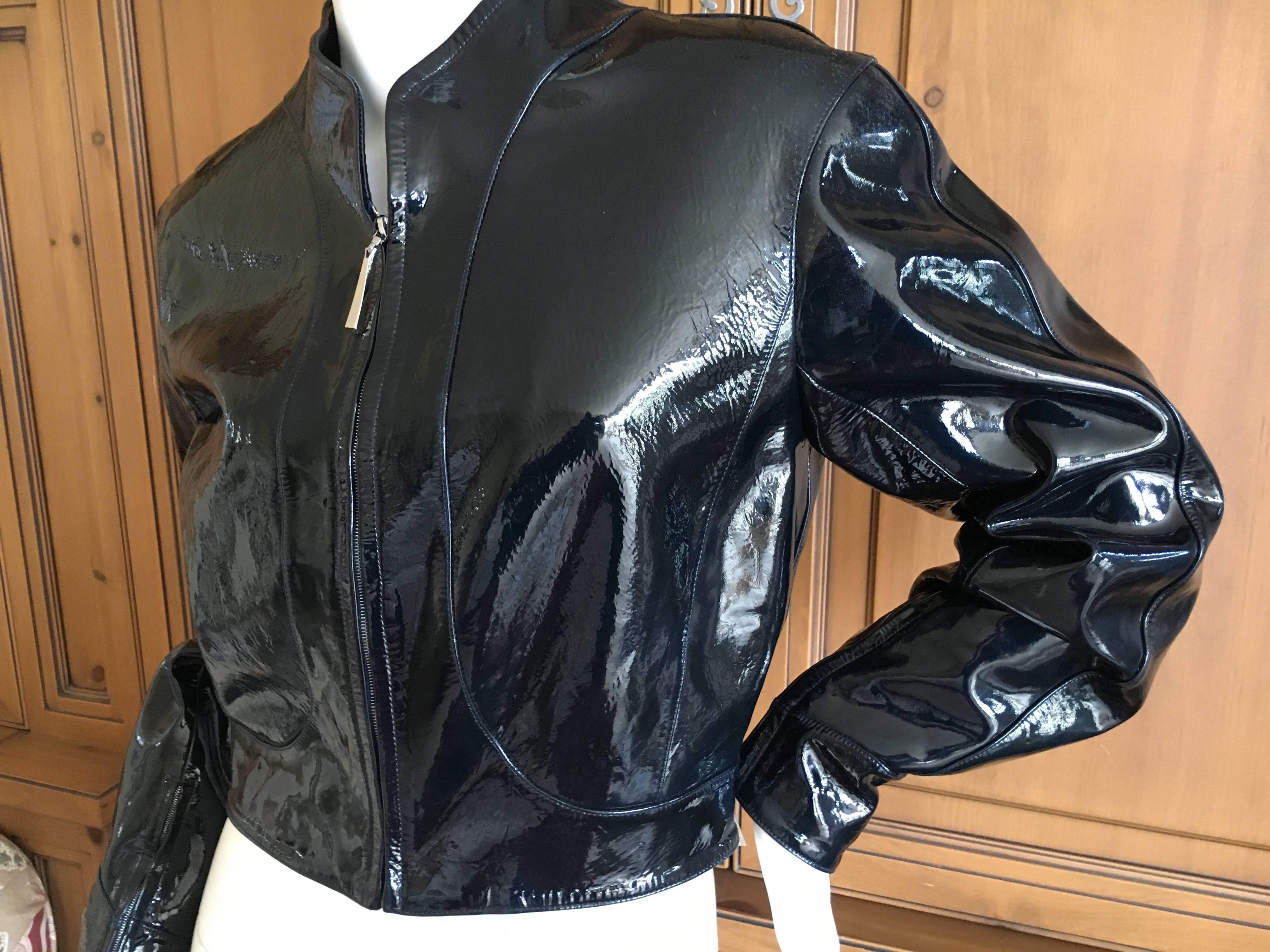 Wonderful dark navy blue patent goatskin leather cropped jacket from Thiuerry Mugler Couture, circa 1988.
This is a very dark navy blue, but it can appear black in some light.
Size 38
Bust 38"
Waist 29"
Length 18"
Sleeve