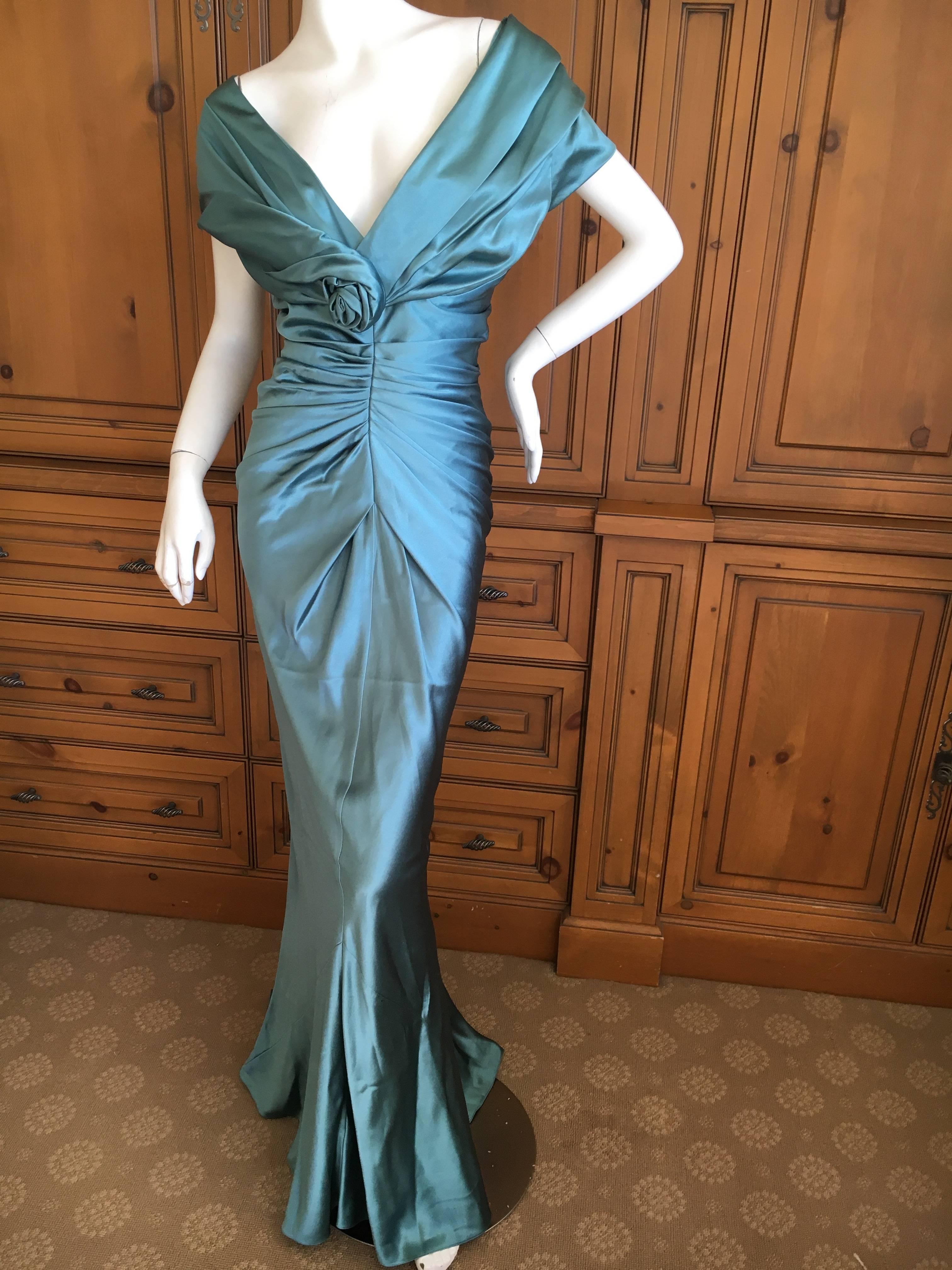 Christian Dior by John Galliano Exquisite Low Cut Silk Evening Dress .
Stunning silk gown in a luscious shade of blue, with a low cut and cowl back.
Size 42
Bust 42