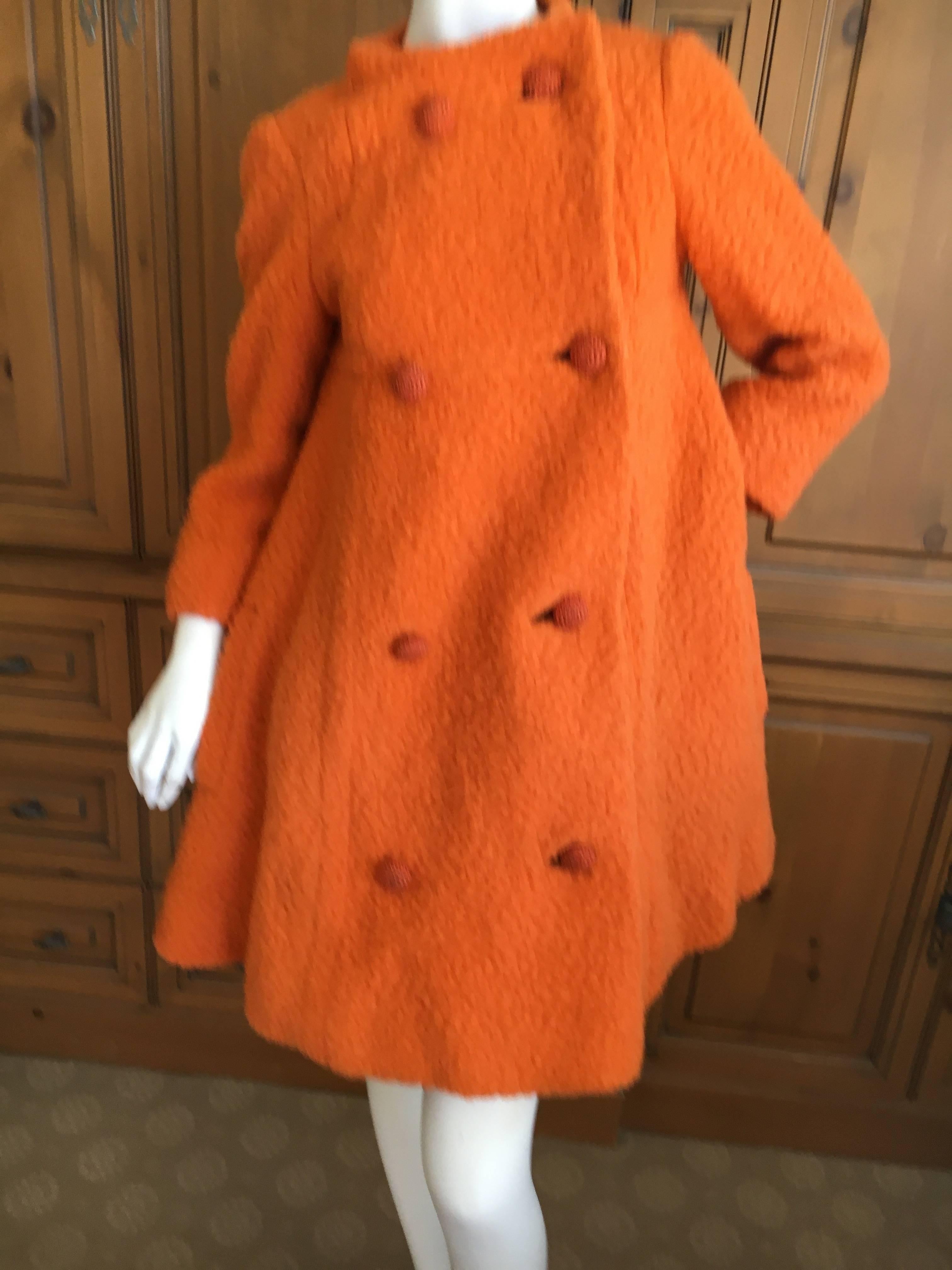 Bergdorf Goodman 1965 Babydoll Boucle A Line Swing Coat.
This is so sweet, so Mia Farrow Rosemary's Baby.
A perfect maternity coat.
Very textural nubby boucle in tangerine orange.
The lining is a fine irridescent silk, which is damaged under each