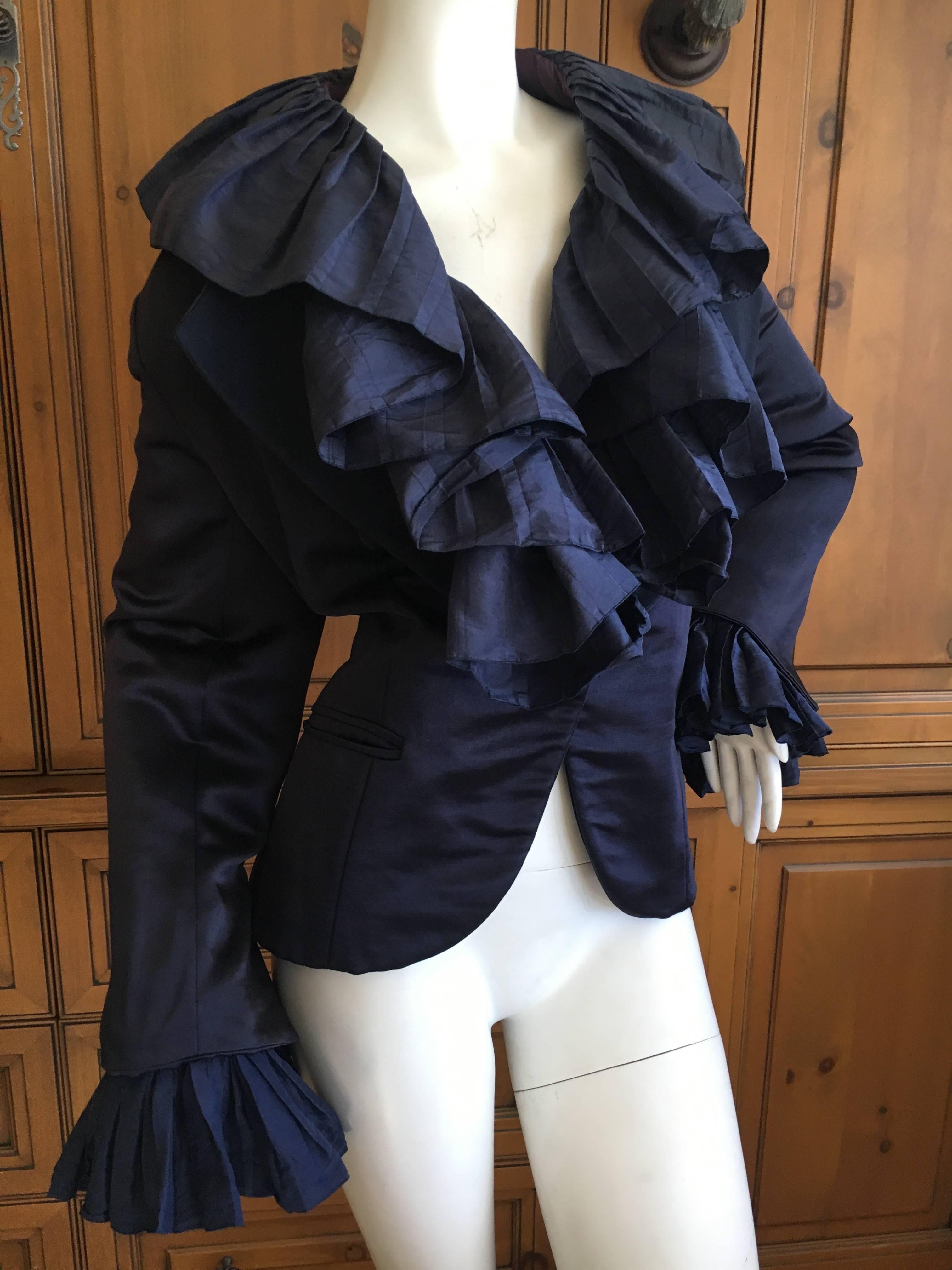 Christian Dior Numbered Demi Couture Ruffled Silk Jacket by Gianfranco Ferre.
Dark navy blue, with exaggerated ruffles on the collar and cuffs, so Ferre.
Runs quite large.
Bust 44