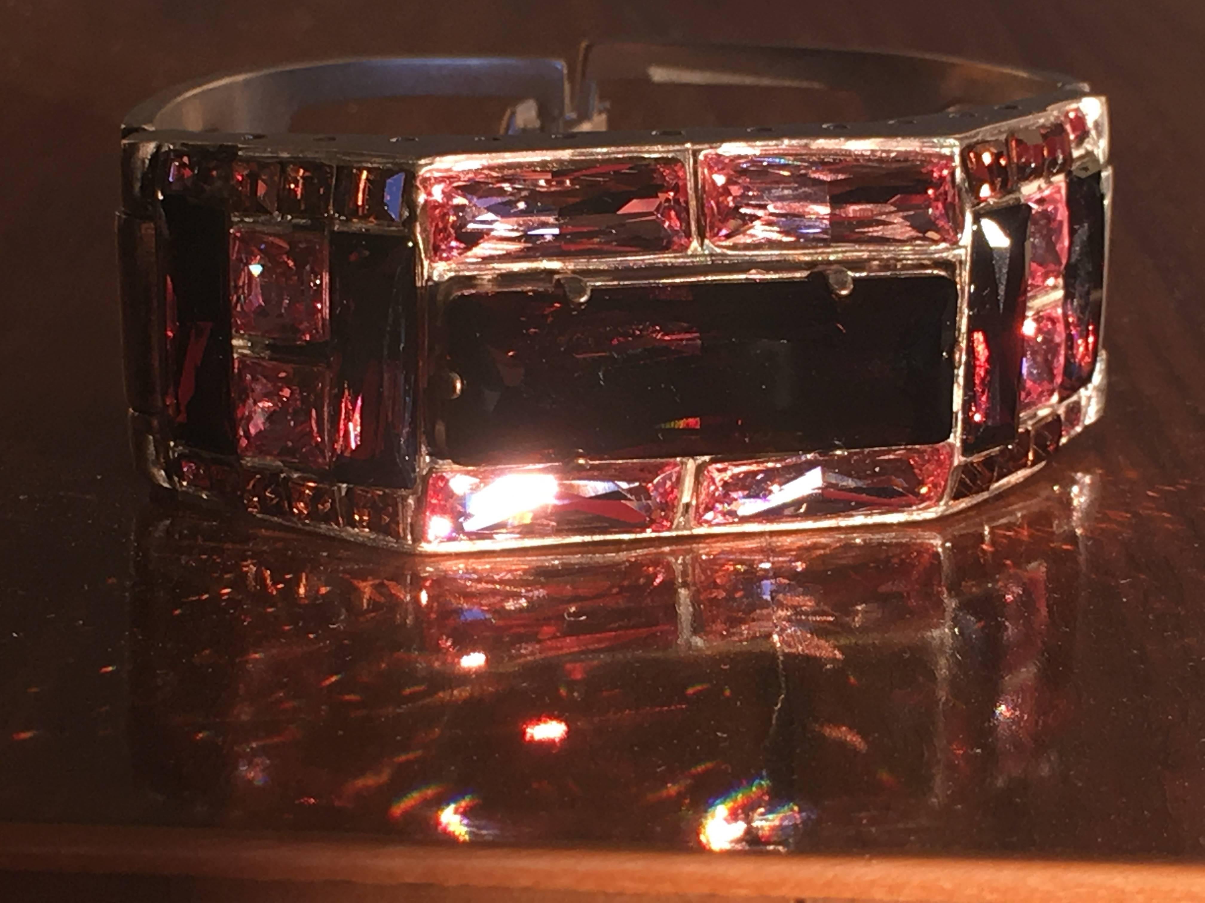 Jean Paul Gaultier Crystal Cuff Bracelet.
Beautiful shades of pink and rose, accented with topaz, set in matte silver tone metal.