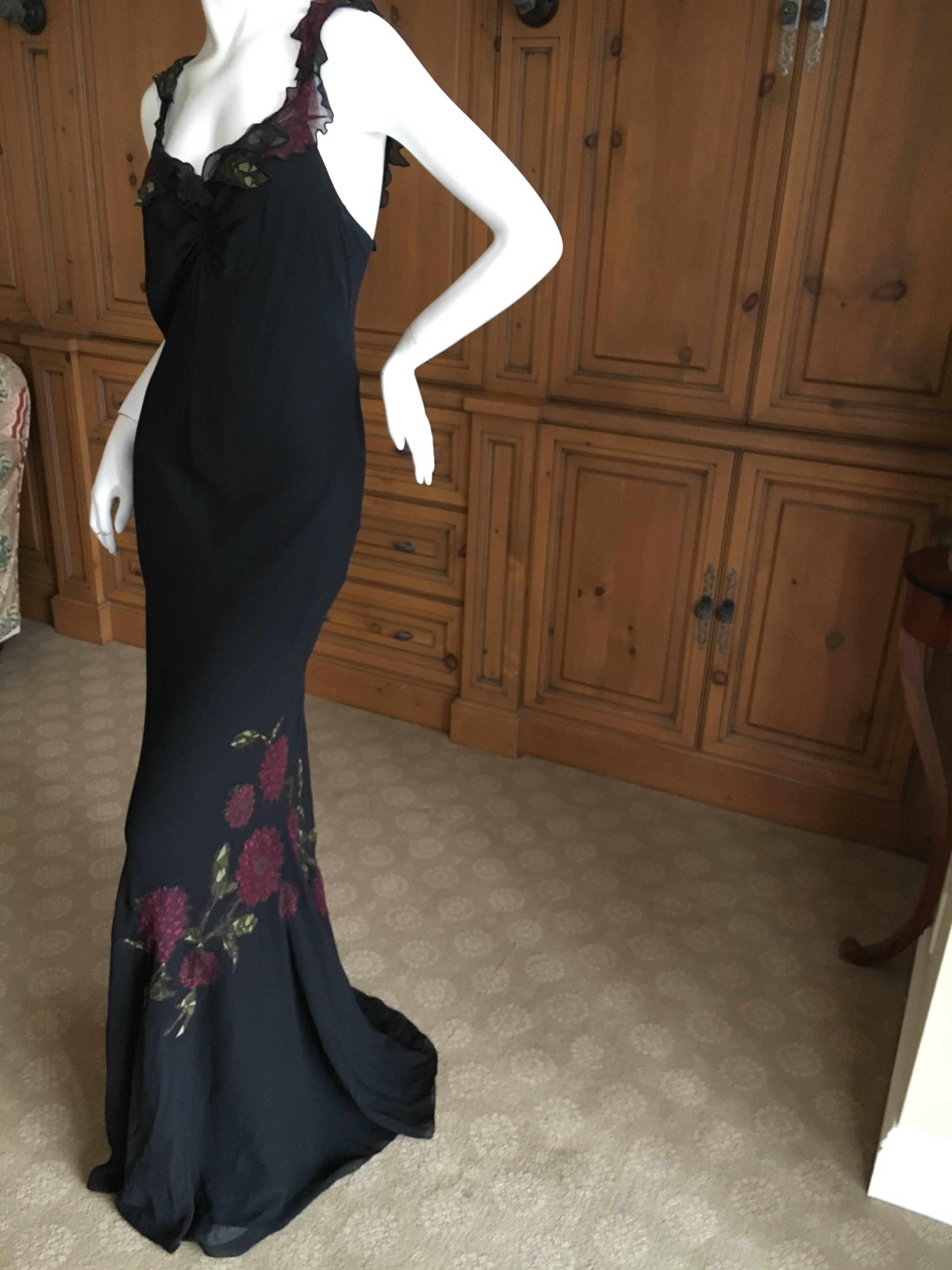 Beautiful bias cut black evening dress from John Galliano circa 1999.
There are sheer floral appliqués throughout with delicate floral treatment on the neckline and straps. 
So much prettier in person , it is difficult to photograph .
Size 42
Bust