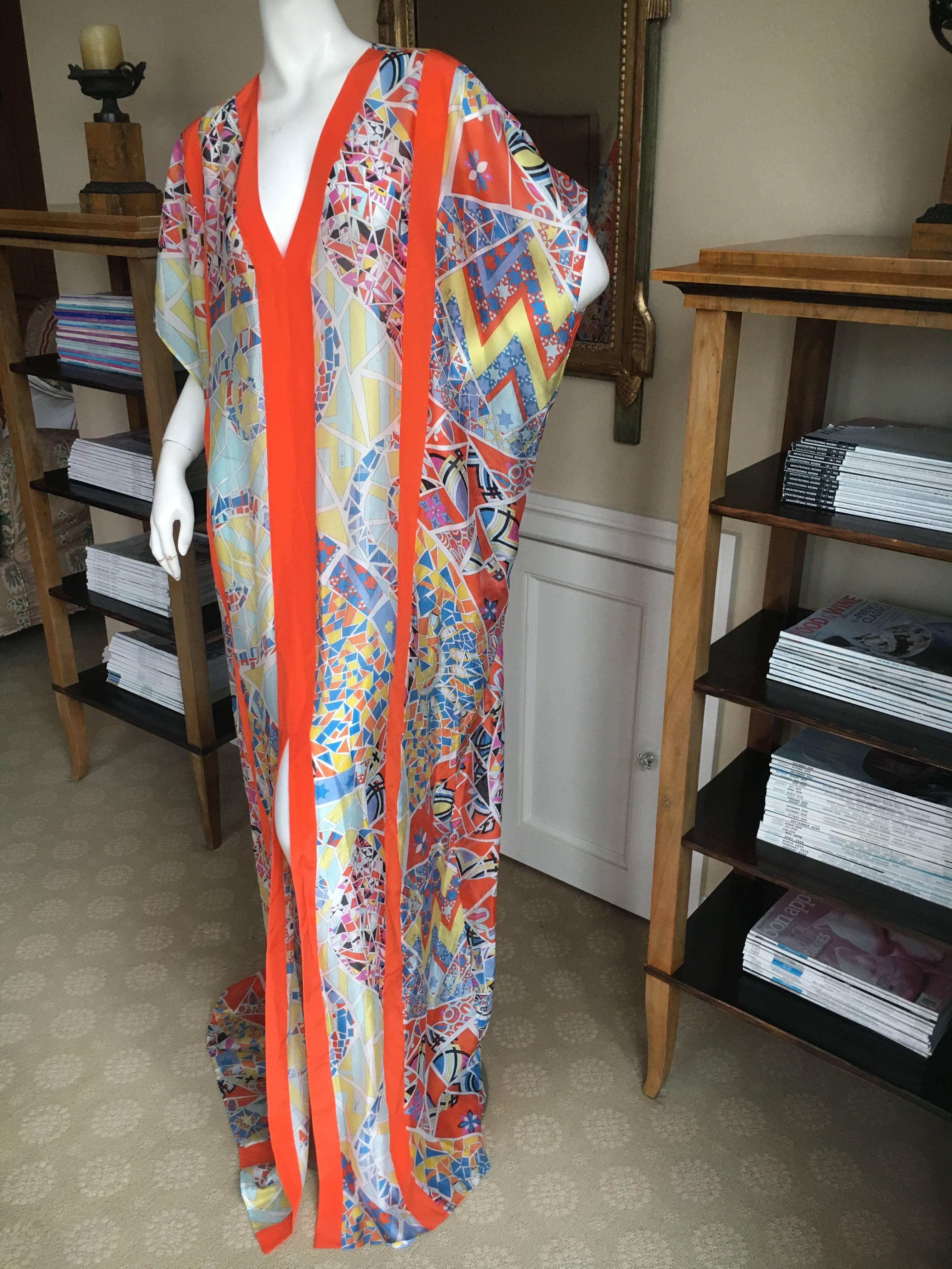 Brilliant kaleidoscope pattern sheer silk caftan from Emilio Pucci.
This is a large size with a very long 70+ hemline
Bust 66"
Waist 56"
Length 70"
New with tags