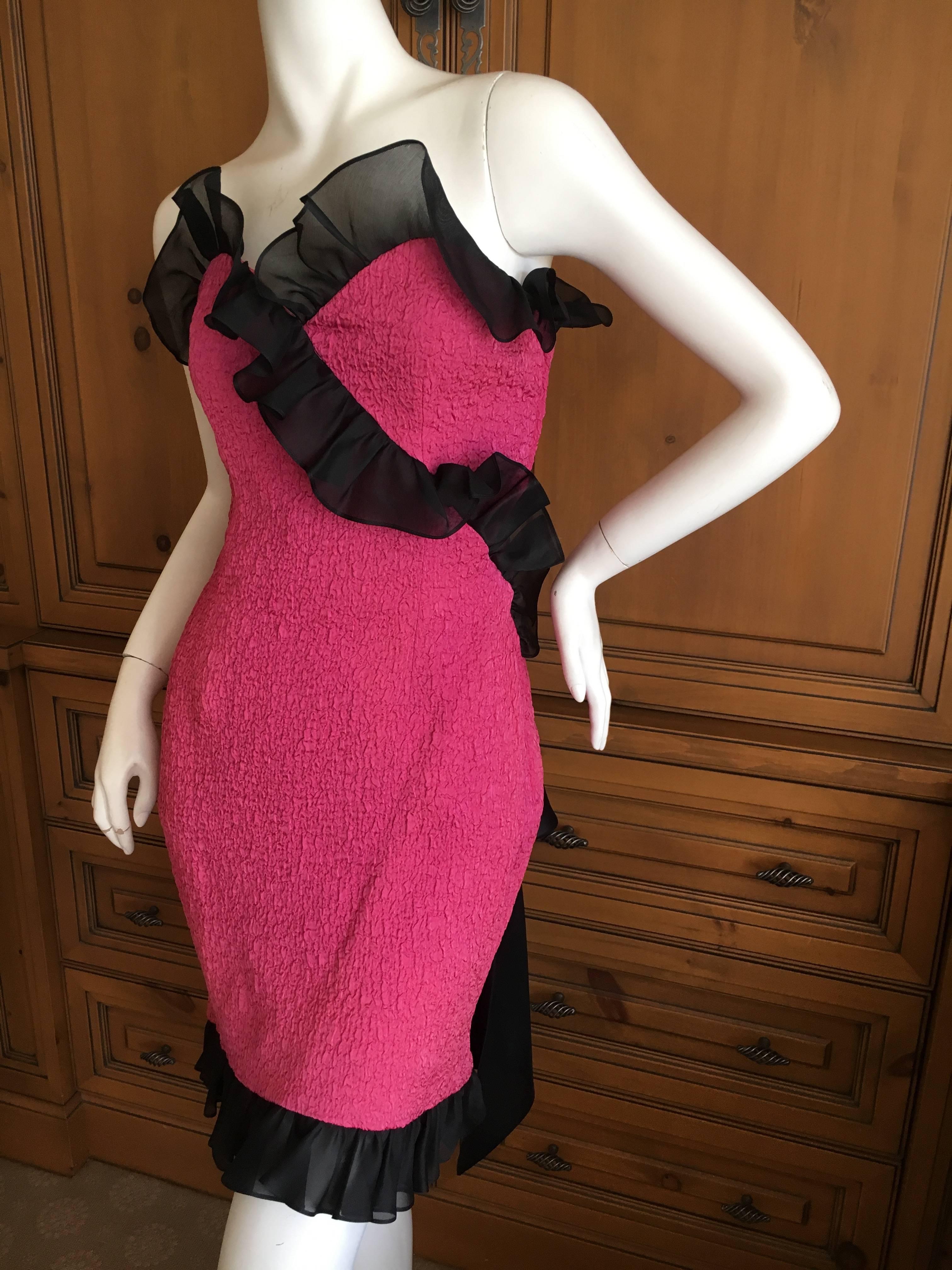 Wonderful hot pink party dress with black ruffles and bows from YSL.
Zips up the side with black ruffles details and large bow on back. 
The bow on the back is floppy , would need starch to stay as I photographed it..
Size 42 from the 1970's would