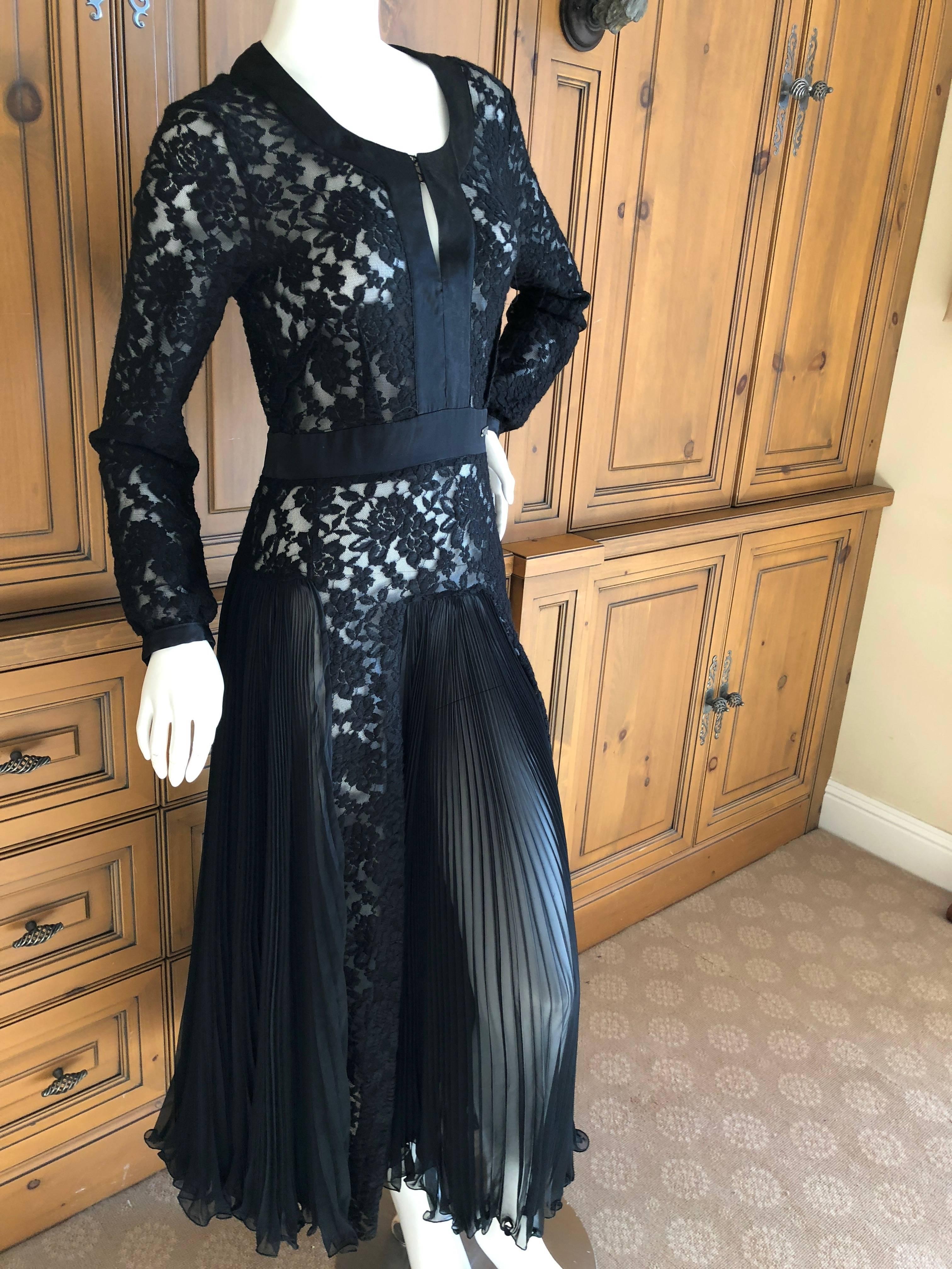 Wonderful sheer lace dress from John Galliano. 
Featuring wide accordion pleated skirt and a beautiful separate slip that can be worn as a dress. I show the dress with and without the slip.
Tea length.
Size 40
Bust 38"
Waist 25"
Hips