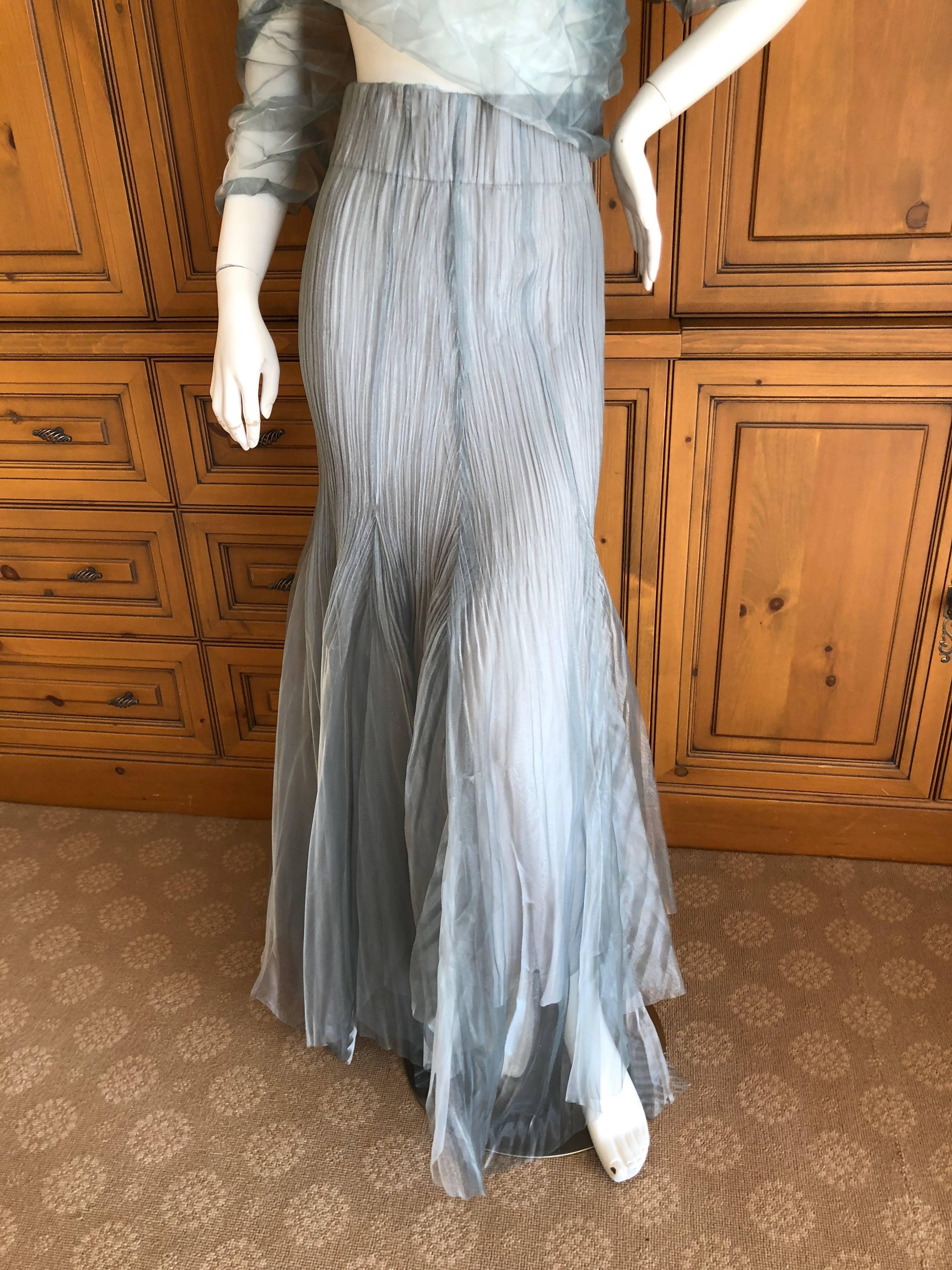 Issey Miyake Fete Vintage Silvery Evening Dress or Skirt w Matching Pyramid Wrap.
New with tags
I am not certain if it is a skirt or strapless dress, can be worn either way.
The shrug is very long and can be styled many ways.
Lots of stretch.
As a