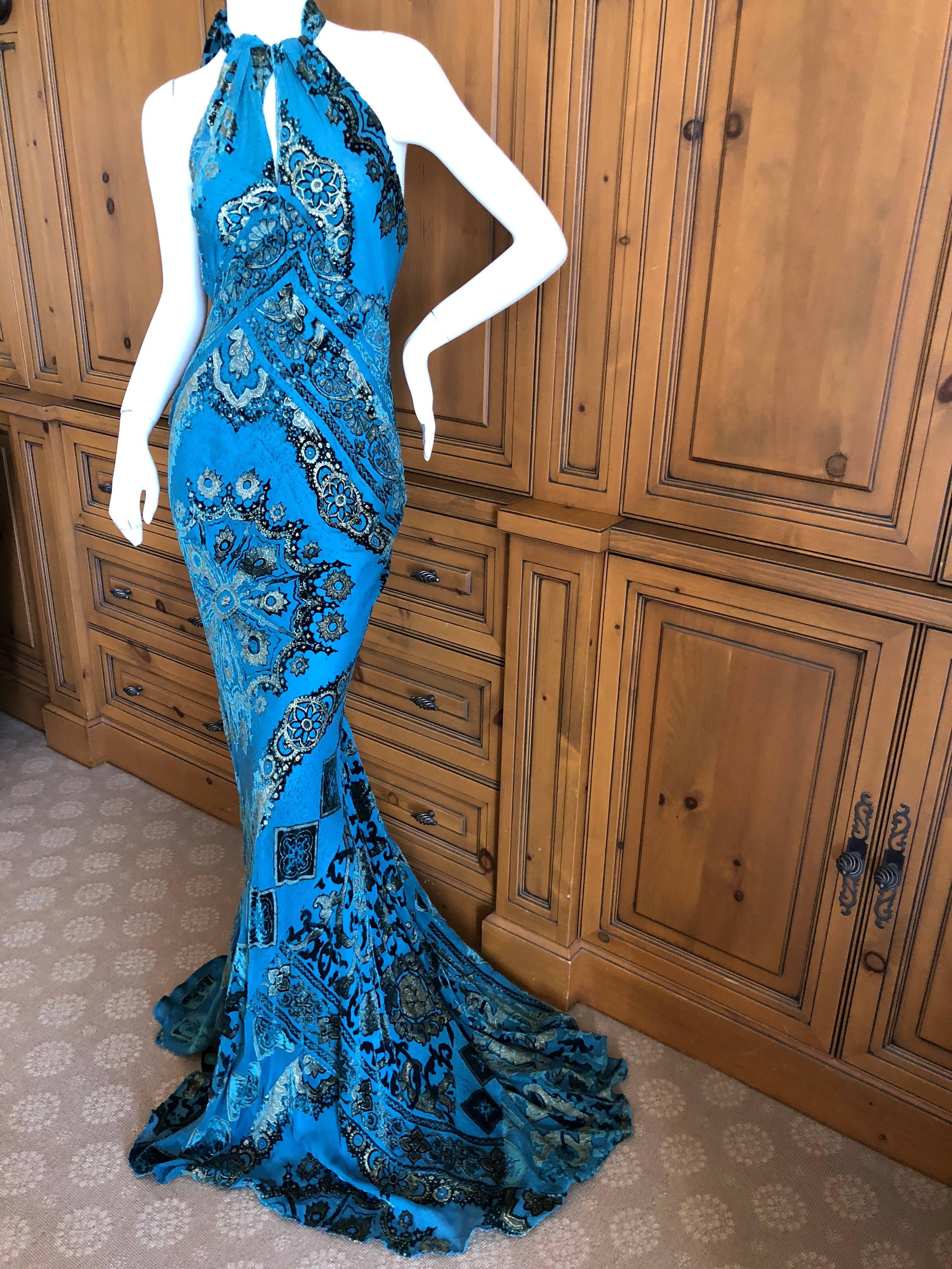 Roberto Cavalli Exceptional Gold Trim Halter Velvet Evening Dress with Full Train.

It is a peacock blue with gold, very Fortuny .

Size M

Bust  38" 

Waist 34" 

Hips 44' 

Length 70"

 Excellent condition
