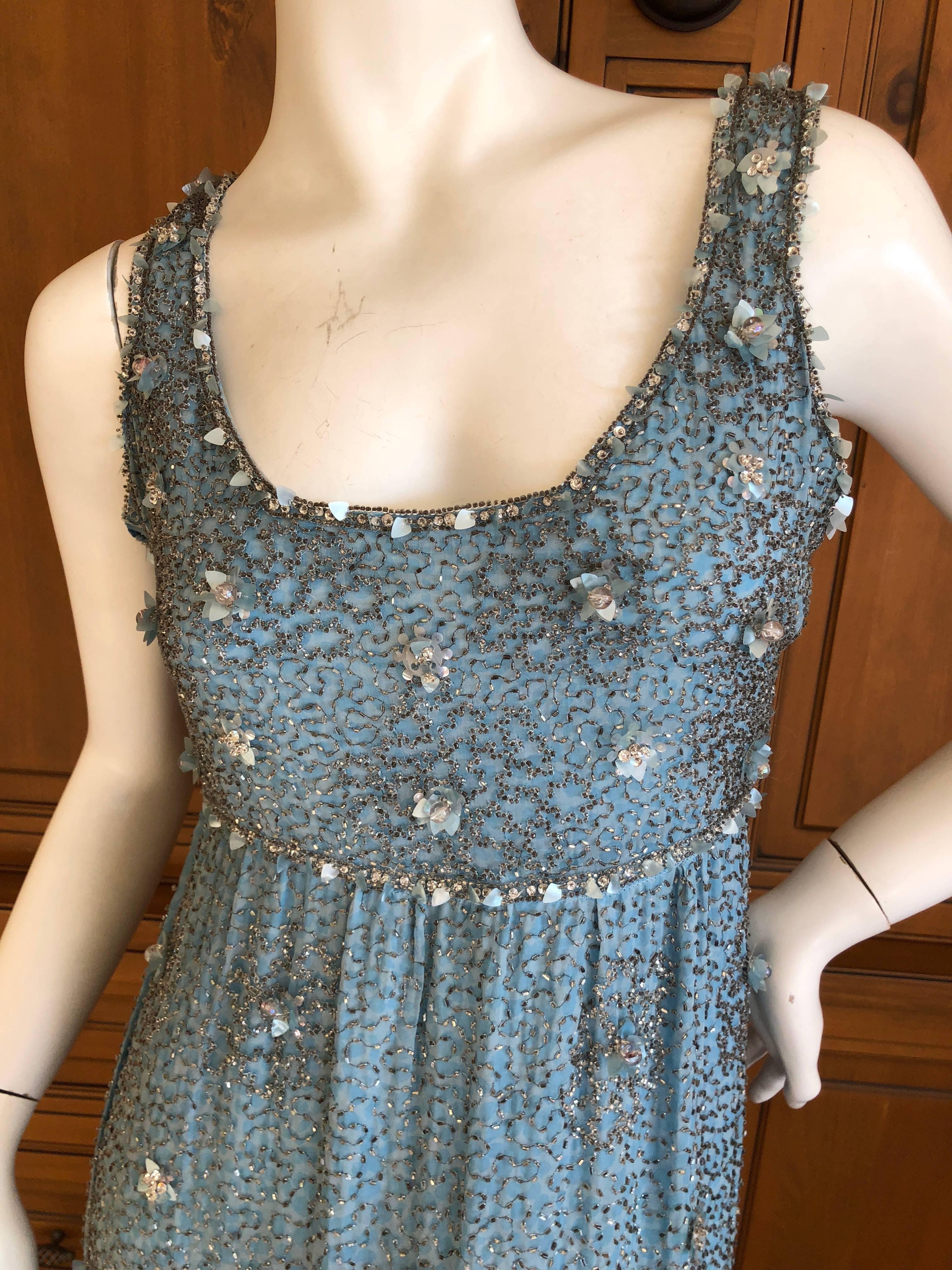 Christian Dior Haute Couture 1968 Bead Embellished Empire Style Evening Dress.
This is amazing, the beadwork has crystals and sequin flowers  by Maison Lesage.
Bust 40"
Waist 32"
Hips 40"
Length 59"
Great pre owned condition,