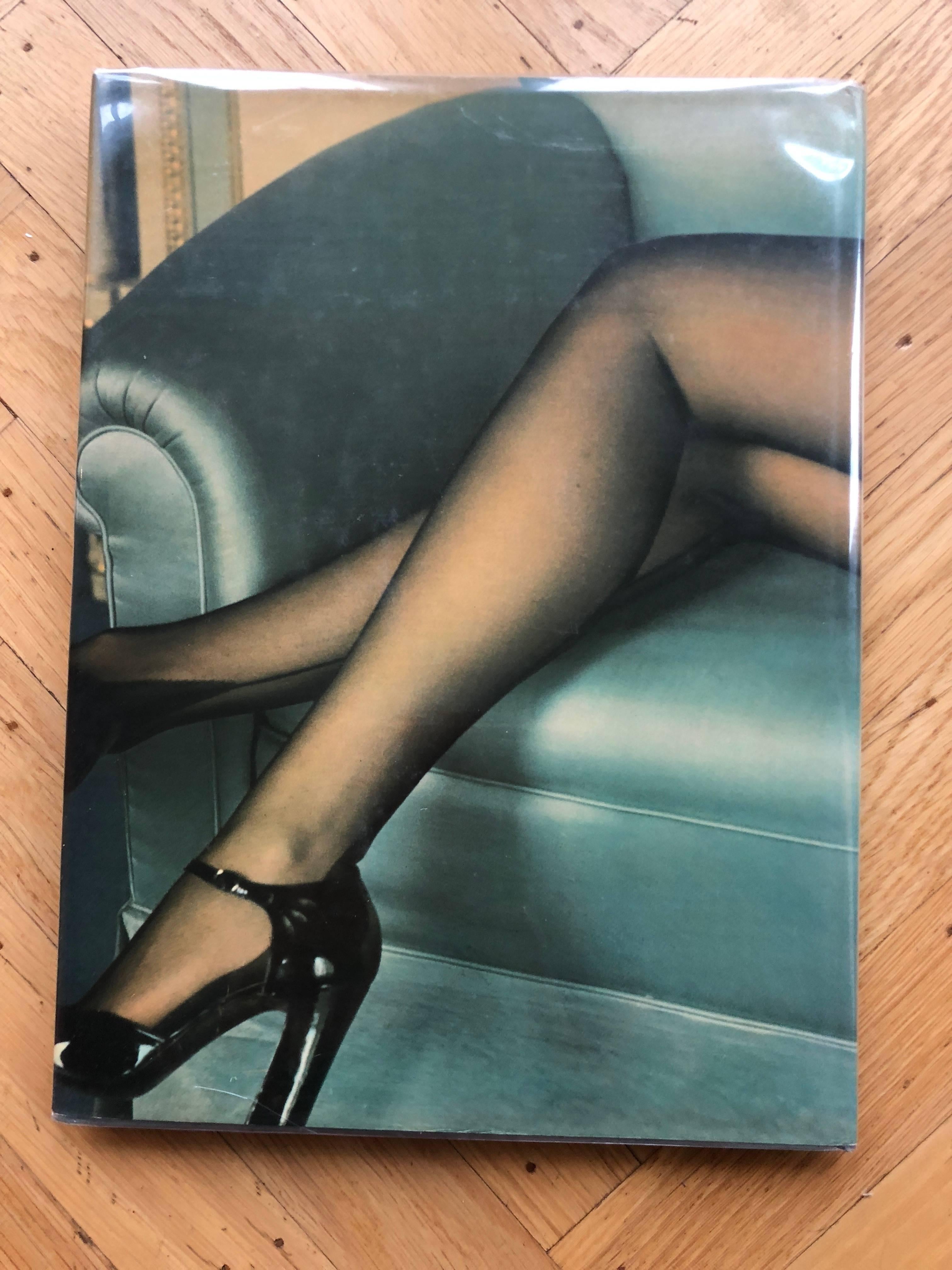 Iconic book from Helmut Newton, 1976.
Groundbreaking in it's time, exotic and erotic images from the master.
12" x 9.5"