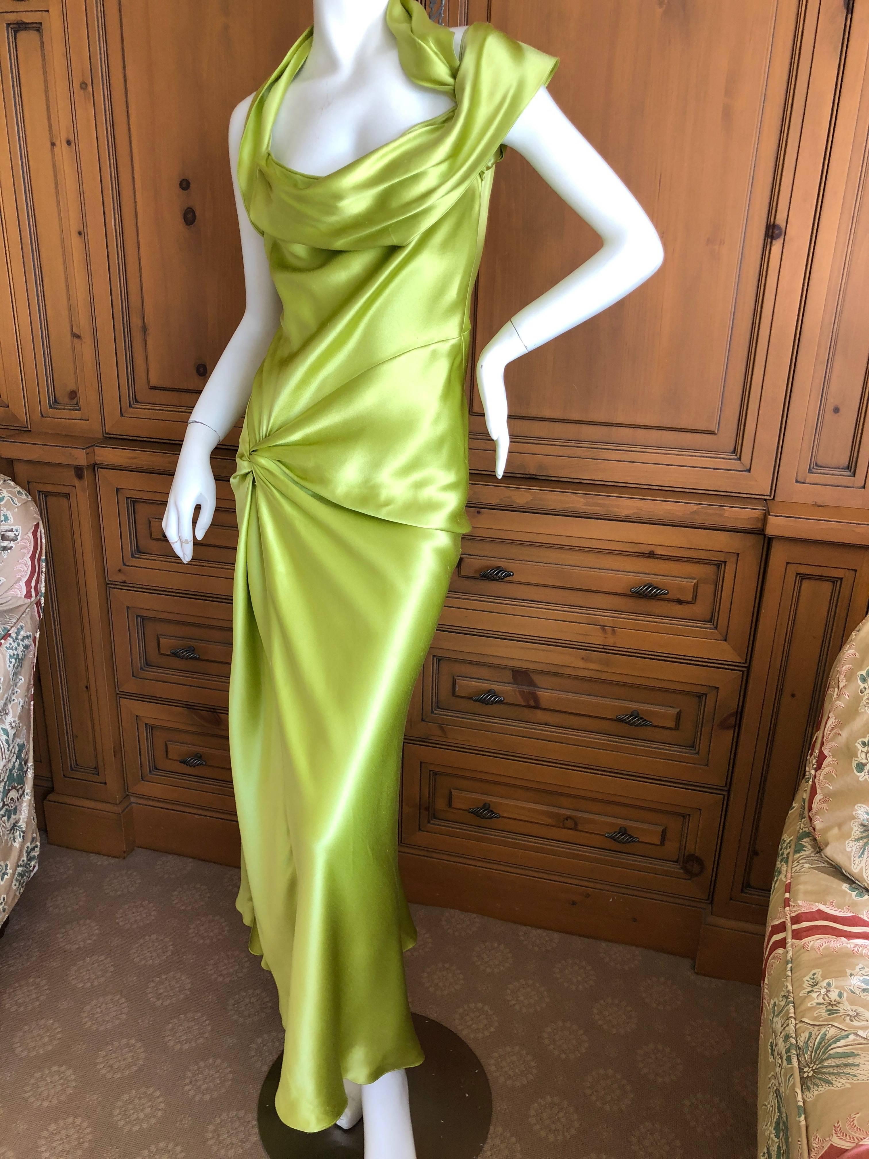 Christian Dior by John Galliano Bias Cut Green Silk Satin Dress with Knot Motif.
Wonderful green silk dress with cowl draped neck, knot at hip, and high slit is cut on the bias for a sensuous form fit , by Galliano.
Size 36
Bust 38