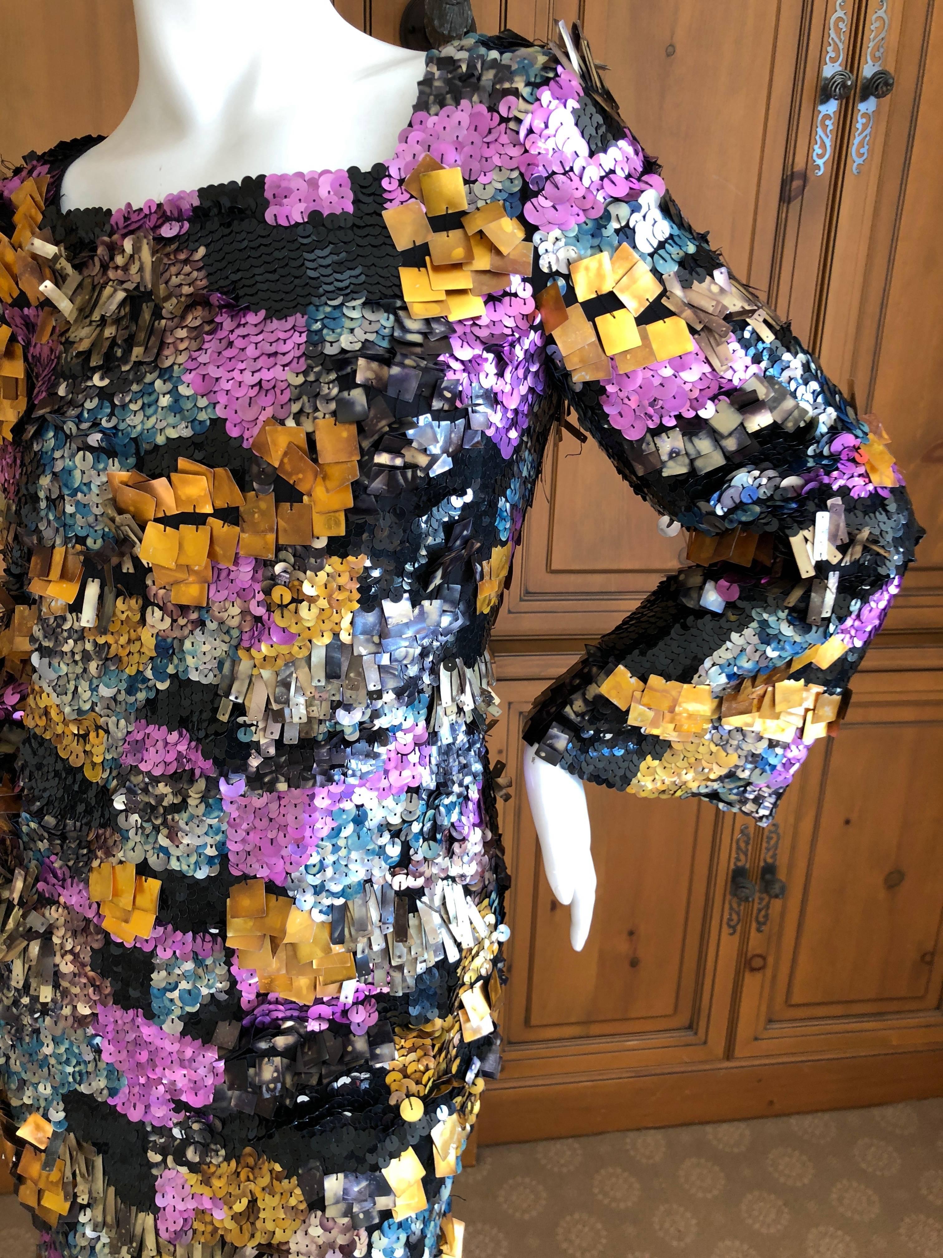 Incredible cocktail dress from Emilio Pucci.
Fully covered with different sequins and pallets, simply astonishing.
Size 40  / 10
Bust 38