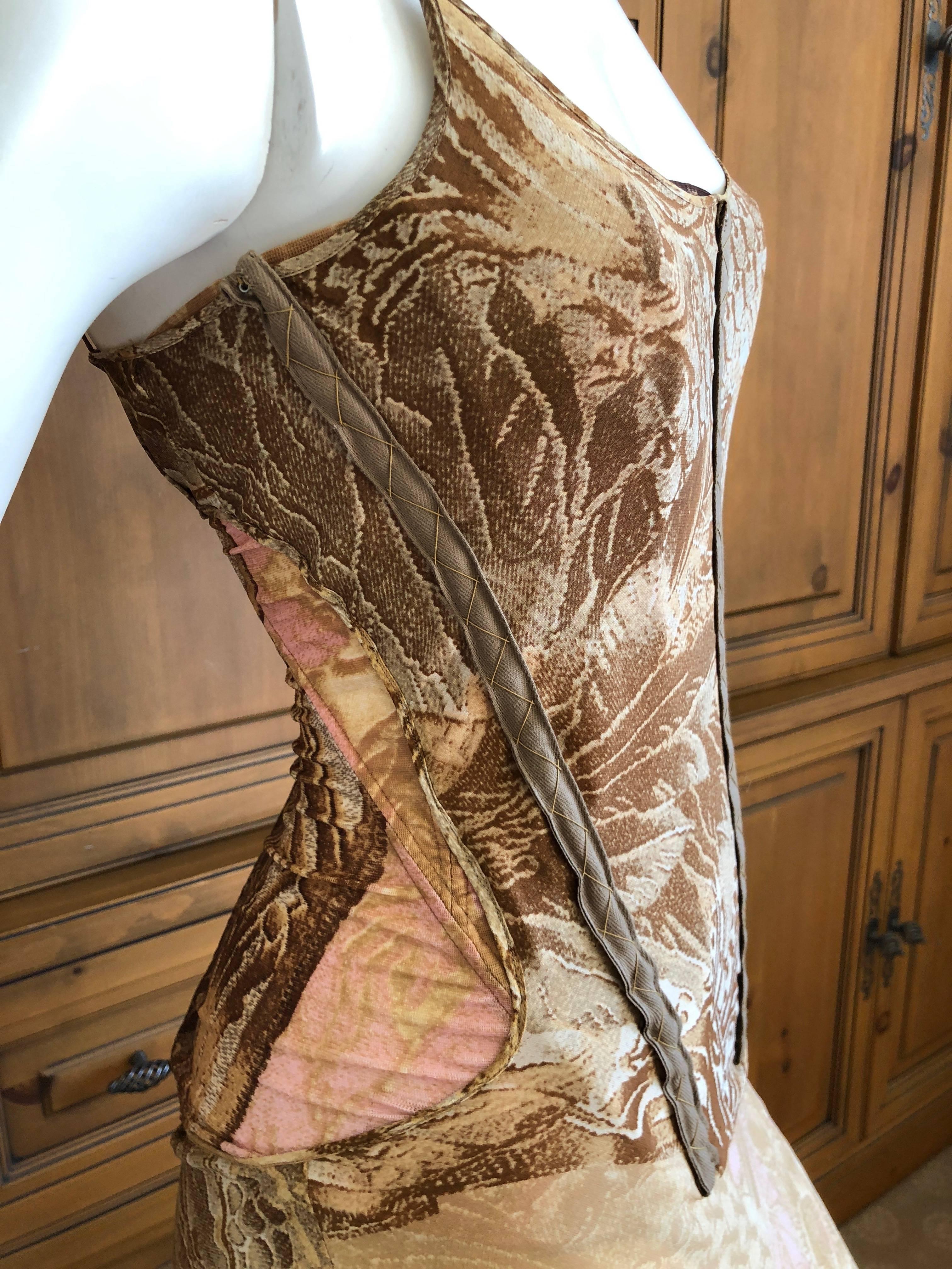 Roberto Cavalli Exceptional Gold Trim Silk Corseted Evening Dress with Full Train.

This is so pretty, and features a boned corset bodysuit, see photo, with an overdress with long train.

The edge of the hemline is raw, un hemmed and intentionally