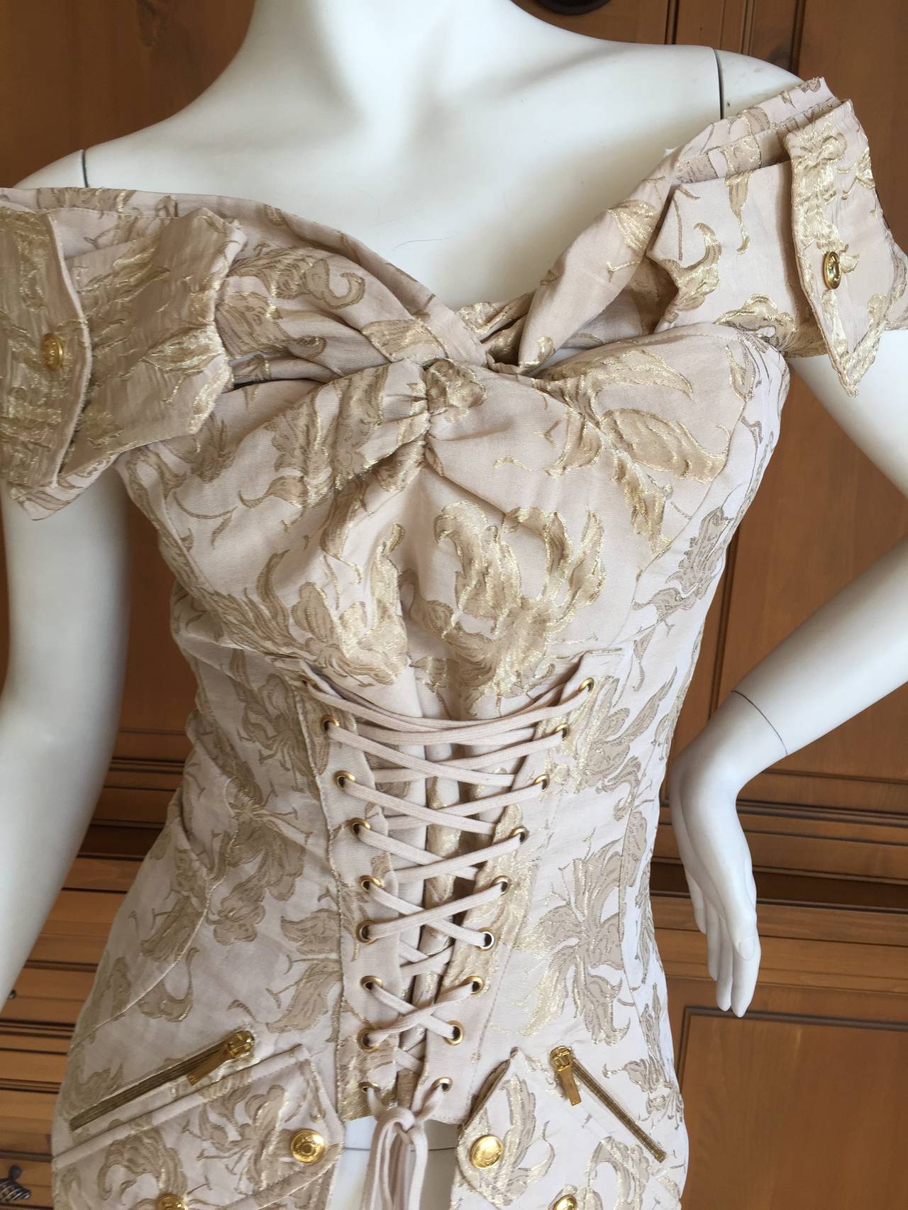 Christian Dior by John Galliano Divine Gold Jacquard Corset Lace Top

This is a zip corset like top with a bandalero over the shoulders

French 42

Bust 36