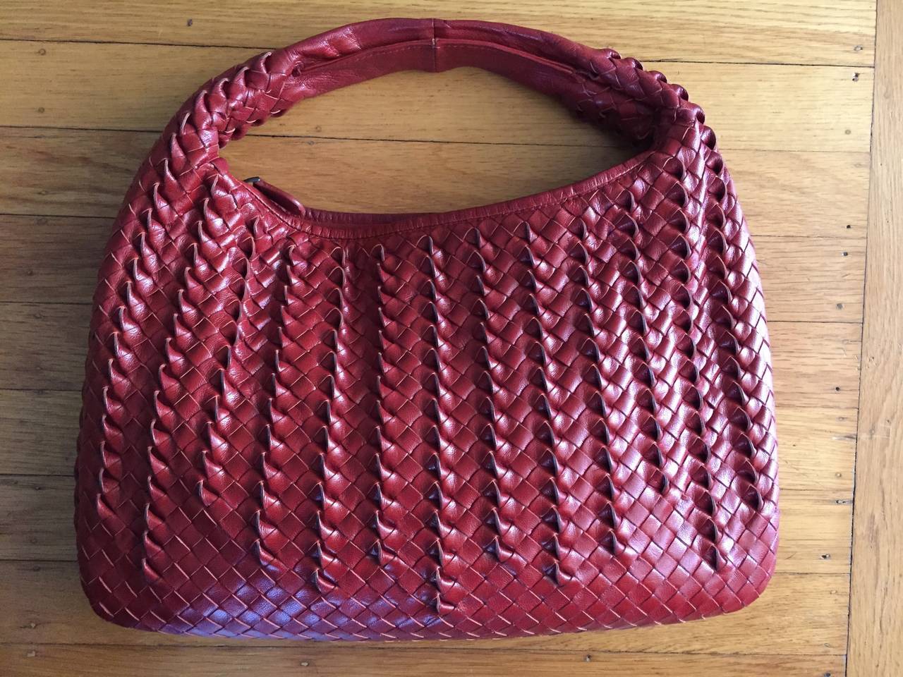 Bottega Veneta Red Intrecciato Leather Hobo Bag.

This is a different type of Intrecciato weaving, it has a twist.

This is such a gorgeous bag, the photos don't do it justice. A classic to own a lifetime.

In excellent condition.
15 1/2
