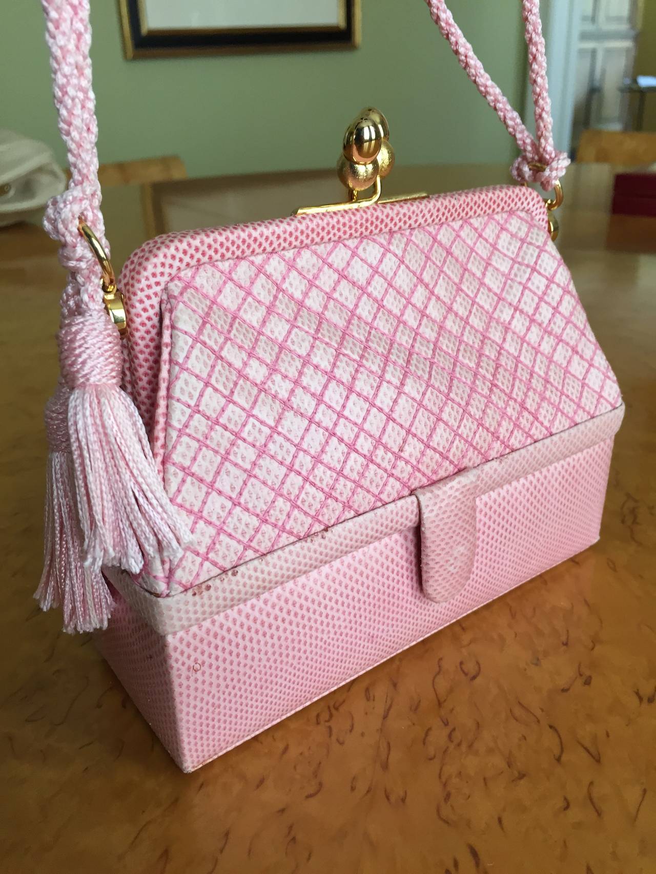 Wonderful pale pink quilted bag from Judith Leiber.
This is so adorable, with a small compartment on the bottom.
Change purse but no comb or mirror.
There is slight darkening on some places, I believe this has to do with the treatment of the