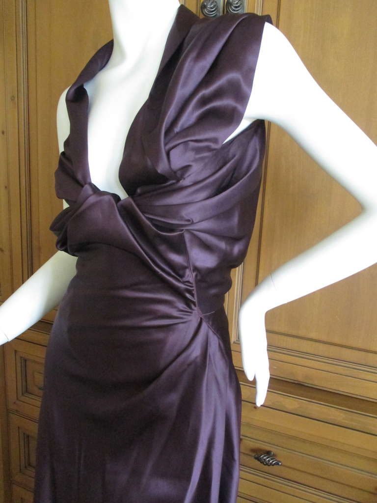 Vivienne Westwood Purple Silk  Corseted Dress.
This has a wide corset built in to the dress, see photo.
I'm not certain I styled it right, there is some complicated construction, including a very diagonal zipper on the bias.