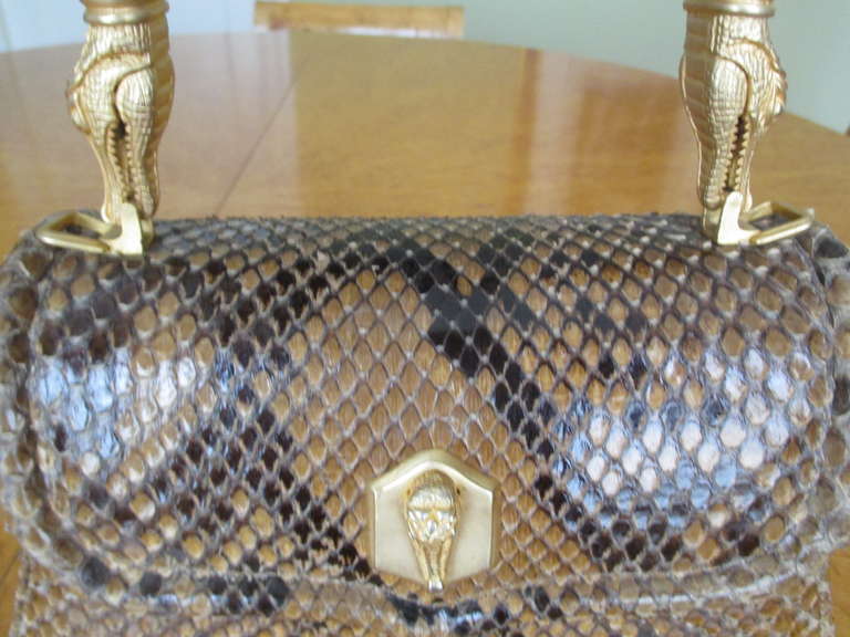 Barry Kieselstei​n-Cord Ultra Rare Snakeskin Trophy Bag 1991
I have never come across a Trophy bag in Snake, very rare
It is a honey color, closer in color to the first photo 
Missing it's detachable shoulder strap

9 1/2