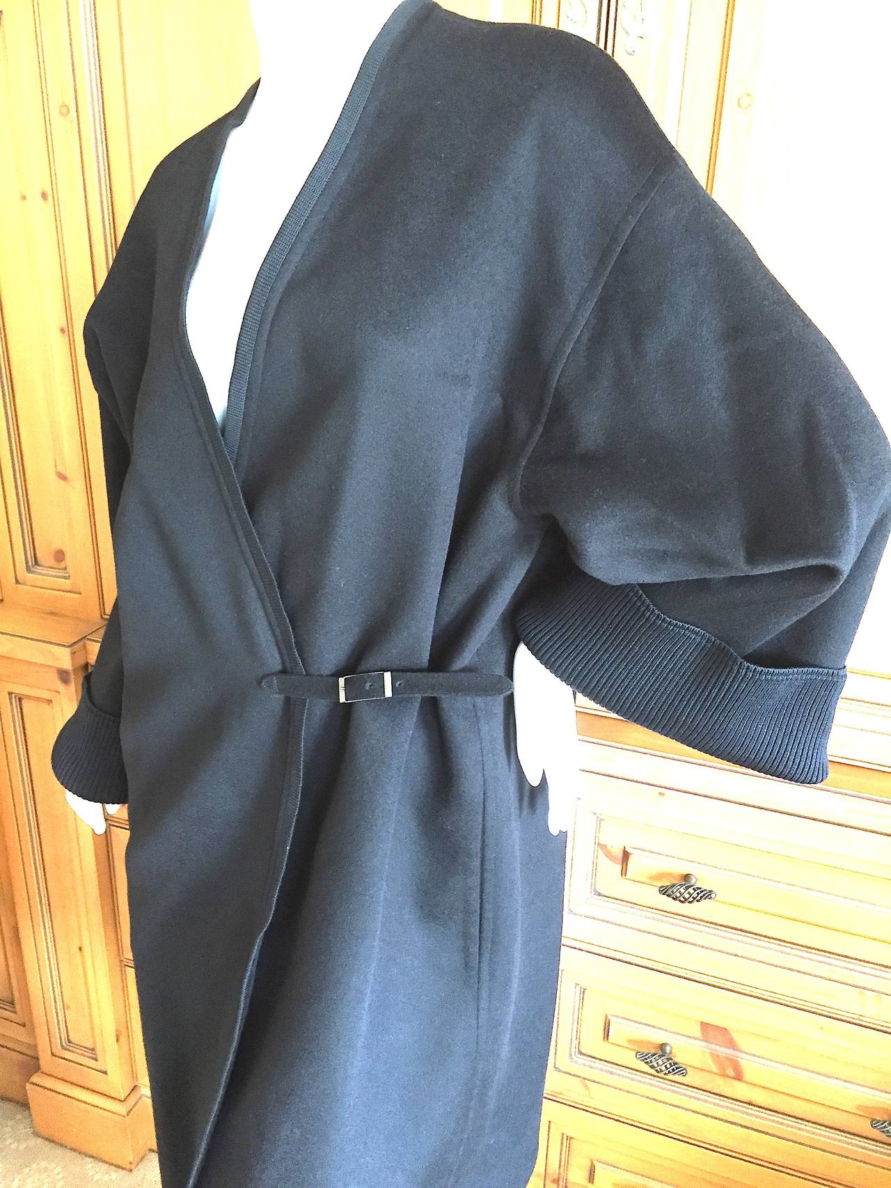 Hermes by Martin Margiela Luxurious Pure Cashmere Coat with Ribbed Cuffs 
There is a leather buckle closure on the side
Made in France
Size 36
This is cut loosly and runs large for the size

Bust 46