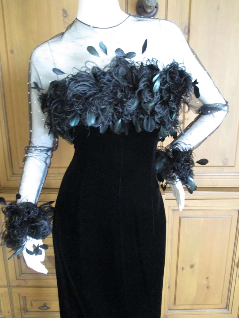 Givenchy 1970's Black Coq Feather Evening Dress.
Elegant Black velvet dress with sheer net crystal accented top adorned with
feathers by Maison Lemarié. 
There is no size label , I would estimate sz 38 Fr , US 8
Bust 38
