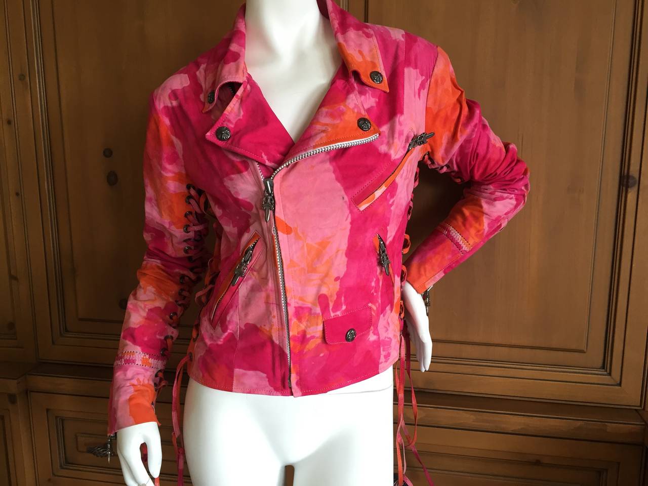 Chrome Hearts Tie Dye Suede Moto Jacket. Techno Color pink, orange and lilac tie dye.
This is a custom made jacket and is really special. Corset lacing up the sleeve and at the sides.
All the hardware is Sterling Silver, including all the grommet