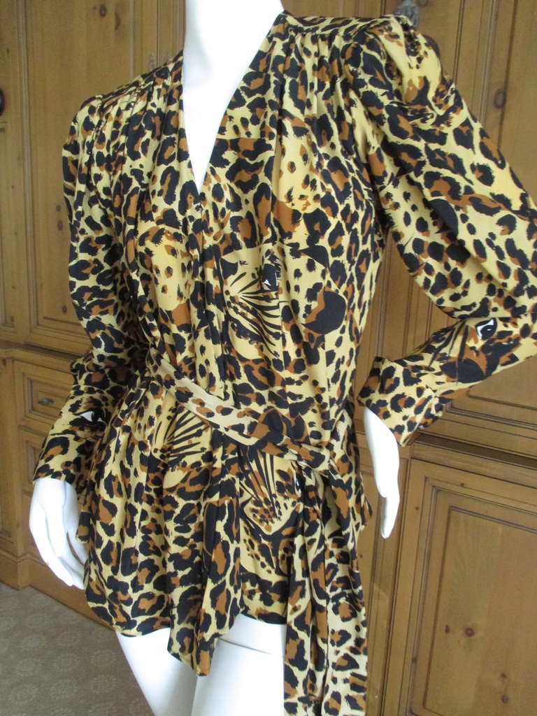 Yves Saint Laurent Rive Guache Vintage 1970's Silk Leopard Belted Top
This is such a beautiful top, much prettier in person.
Wrap style with a belt, pintuck details at shoulders

100% silk

Size 40
Bust: 40