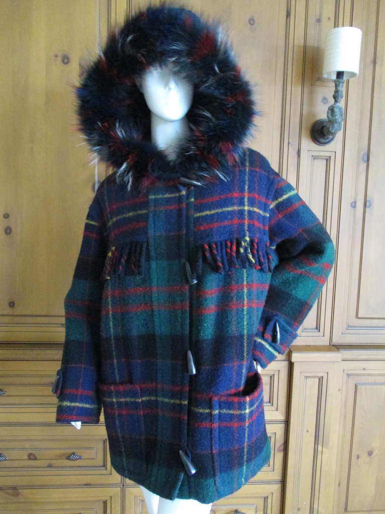 Yves Saint Laurent Fourrures Fringe Plaid Toggle Blanket Coat with Fur Trim Hood

Vintage 70's Purchased in Paris
Wool Plaid lined in quilted bemberg
No size tag appx sz 42 Fr , 10 US

Bust: 44 in.
Waist: 46in.
Length: 32 in.