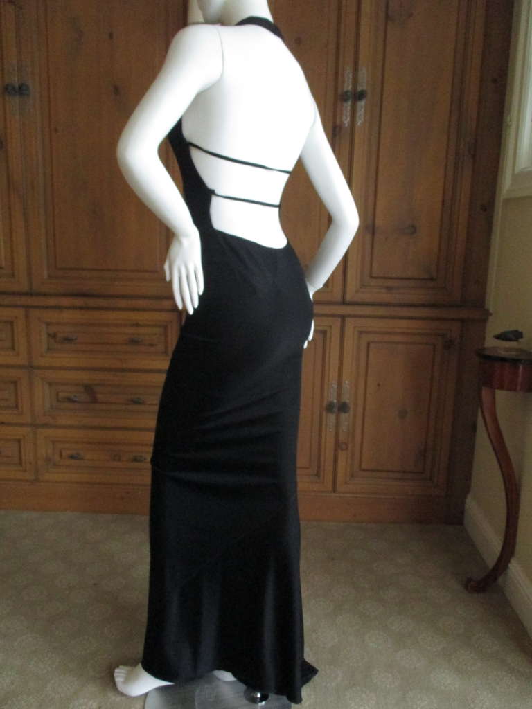 Sensational Azzedine Alaia Vintage Black Backless Dress.
Featuring a halter front, this is backless to the bum save two strap's.
Sz Small, the halter will accomodate various bust sizes