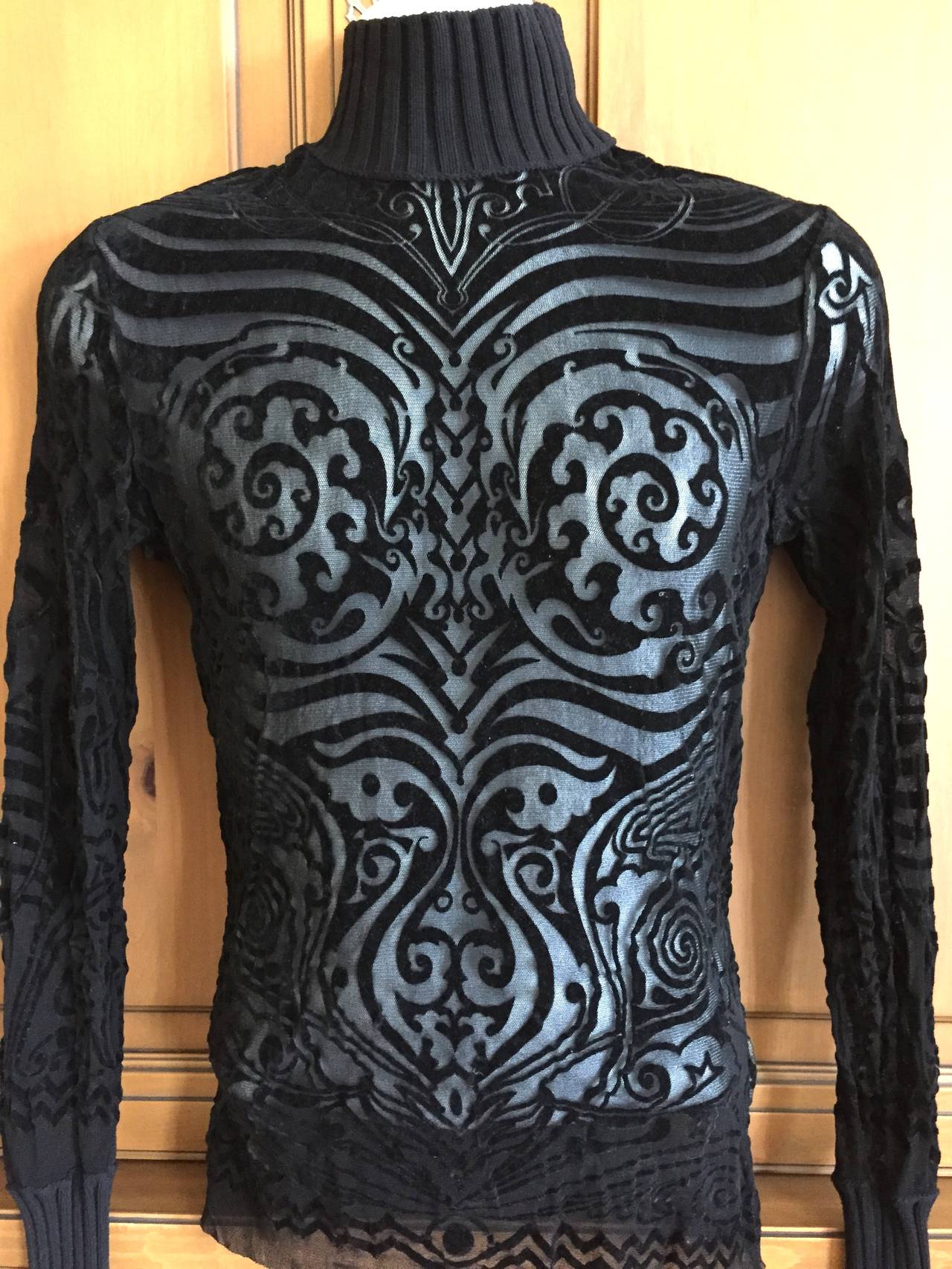 Jean Paul Gaultier Rare Vintage Men's Tattoo Shirt.
Sheer cut out in this tattoo pattern is amazing.
Ribbed wool cuffs and collar
Chest 40