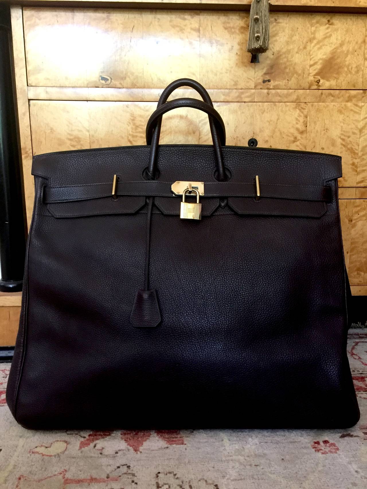 Hermes Birkin 50 HAC (Haut à Courroie ) Togo Leather Travel Bag.

The ultimate mens travel bag.
One of a Pair in my store .
A classic to last a lifetime.
Created in 2002, the date stamp reads F in a circle.
Dark Brown Togo Leather. Gold