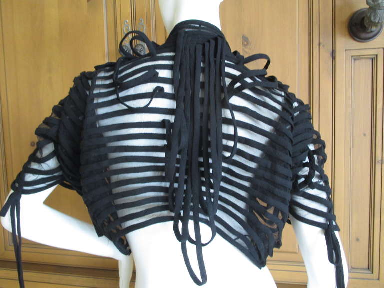 Chado Ralph Rucci Rare Couture Label Sculptural Web / Bondage Inspired Bolero Jacket.
The black pattern is sewn on to netting, so it is sheer.
Marked size 6, it is tiny, more like a
sz 2 , this is very tiny
No one can compare to Ralph Rucci, the