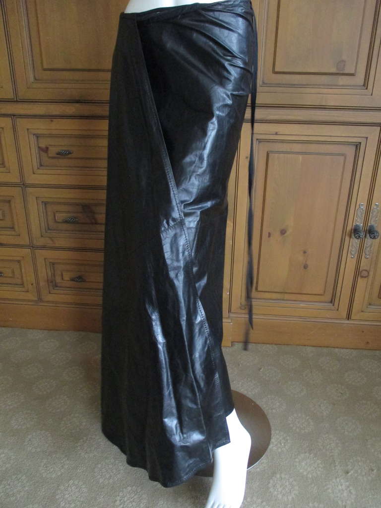 Ann Demeulemeester Black Leather Suit
This is New with Tag's.
The skirt is a wrap style and voluminous. Marked sz 38
It will fit ANY size  there is a mile of leather
Jacket is marked sz 40